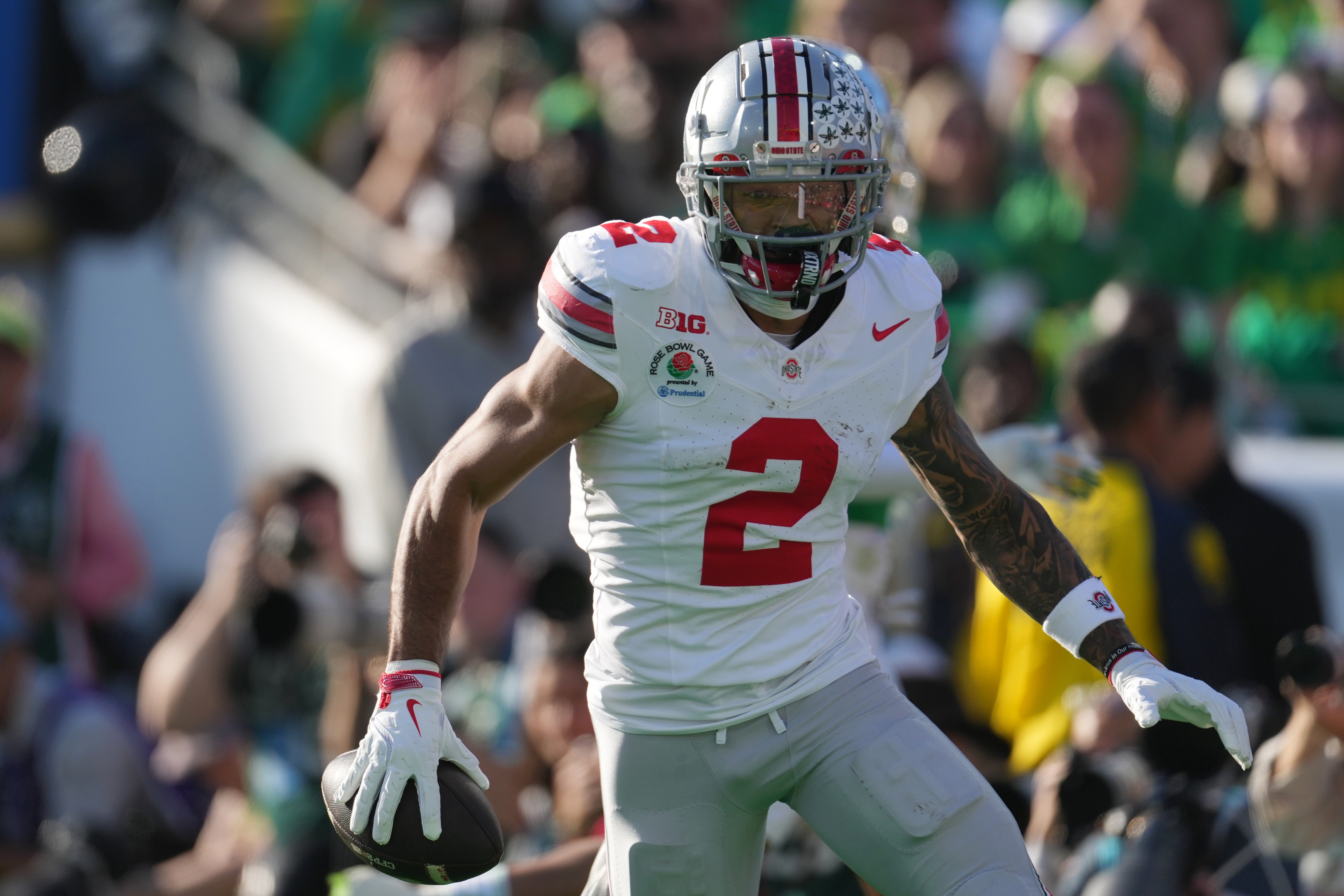 Jan 1, 2025; Pasadena, CA, USA; Ohio State Buckeyes wide receiver Emeka Egbuka (2) celebrates after scoring a touchdown against the Oregon Ducks in the first quarter during the 2025 Rose Bowl college football quarterfinal game at Rose Bowl Stadium. Mandatory Credit: Kirby Lee-Imagn Images