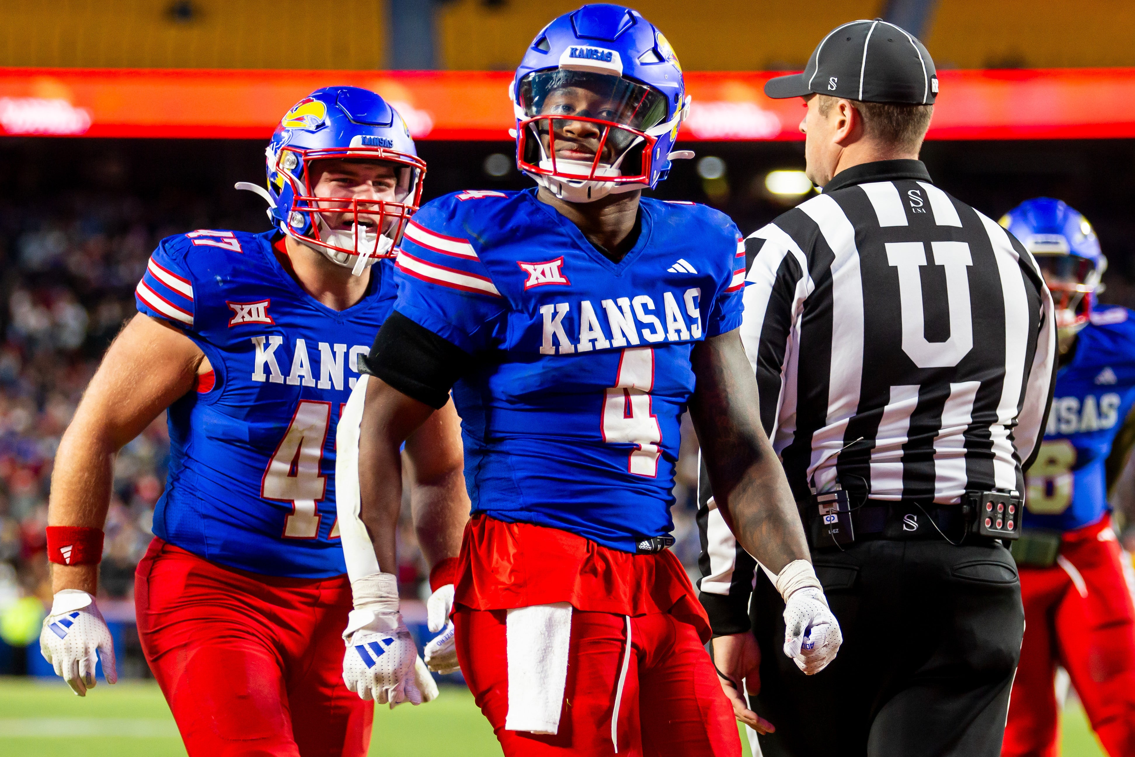 Nov 23, 2024; Kansas City, Missouri, USA; Kansas running back Devin Neal (4) reacts after scoring a touchdown during the 3rd quarter between the Kansas Jayhawks and the Colorado Buffaloes at GEHA Field at Arrowhead Stadium.