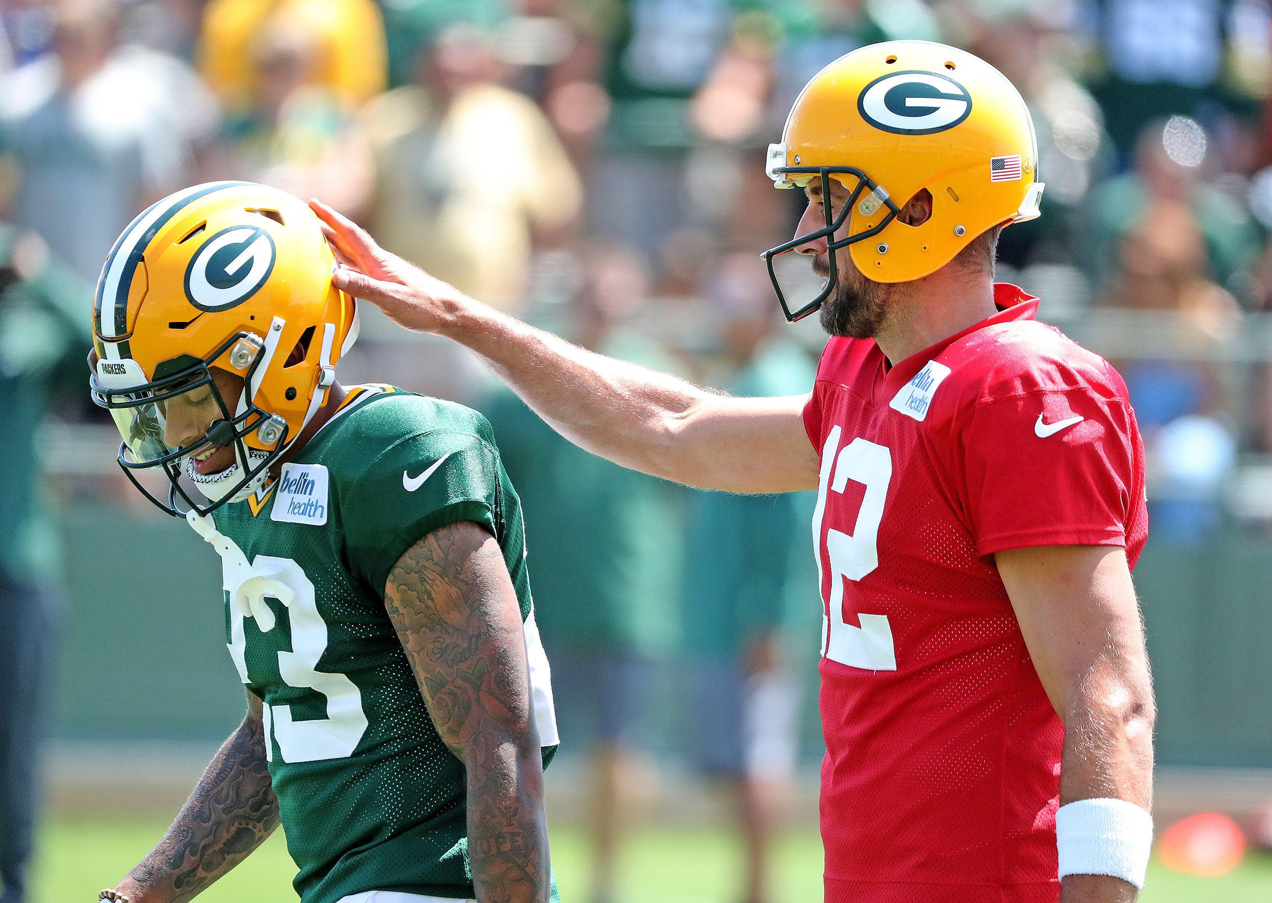Green Bay Packers quarterback Aaron Rodgers (12) gives cornerback Jaire Alexander (23) and encouraging pat on the helmet during Green Bay Packers Training Camp Saturday, July 28, 2018 at Ray Nitschke Field in Ashwaubenon, Wis Packers 2018 04