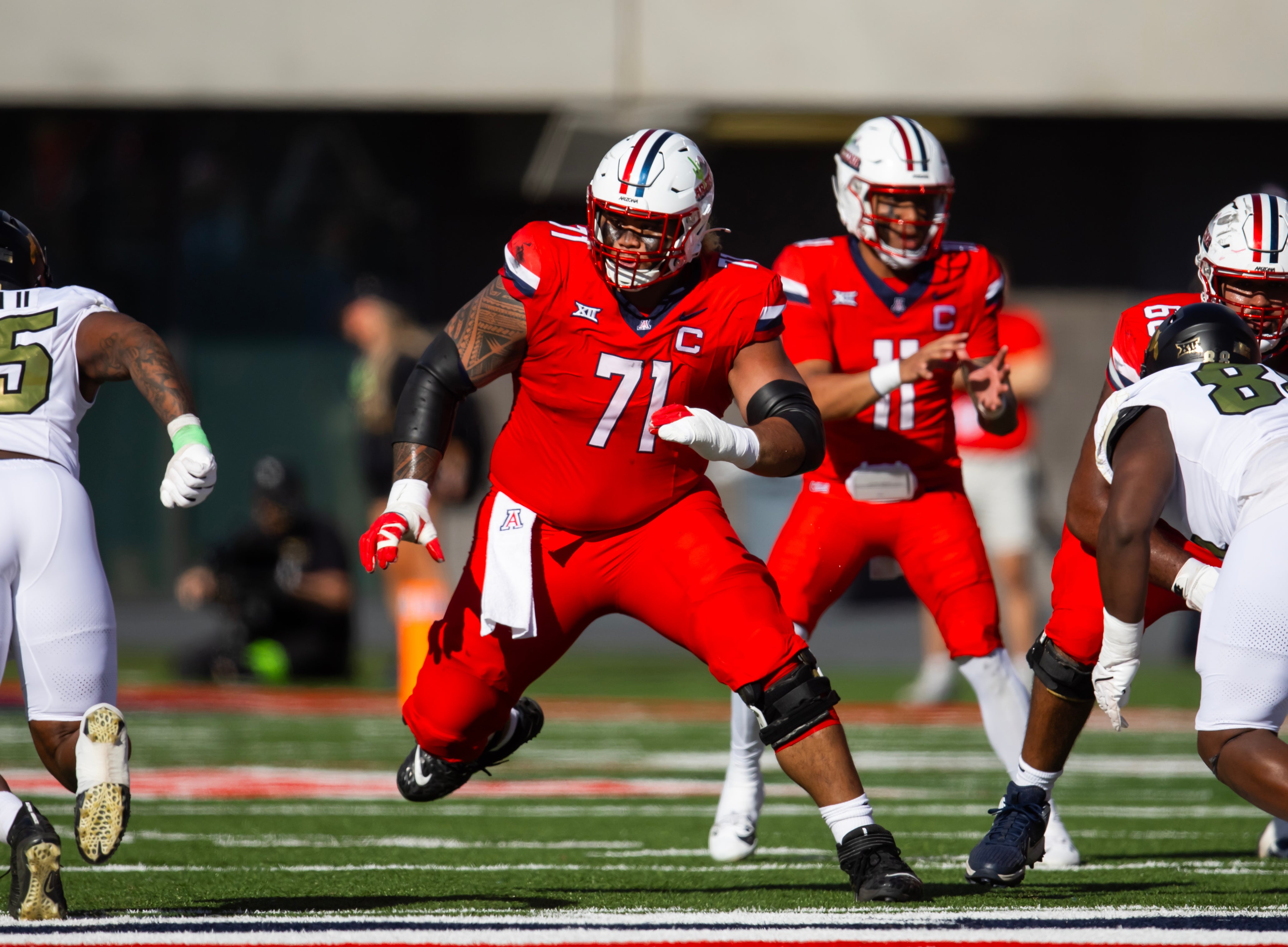 Oct 19, 2024; Tucson, Arizona, USA; Arizona Wildcats offensive lineman Jonah Savaiinaea (71) against the Colorado Buffalos at Arizona Stadium.