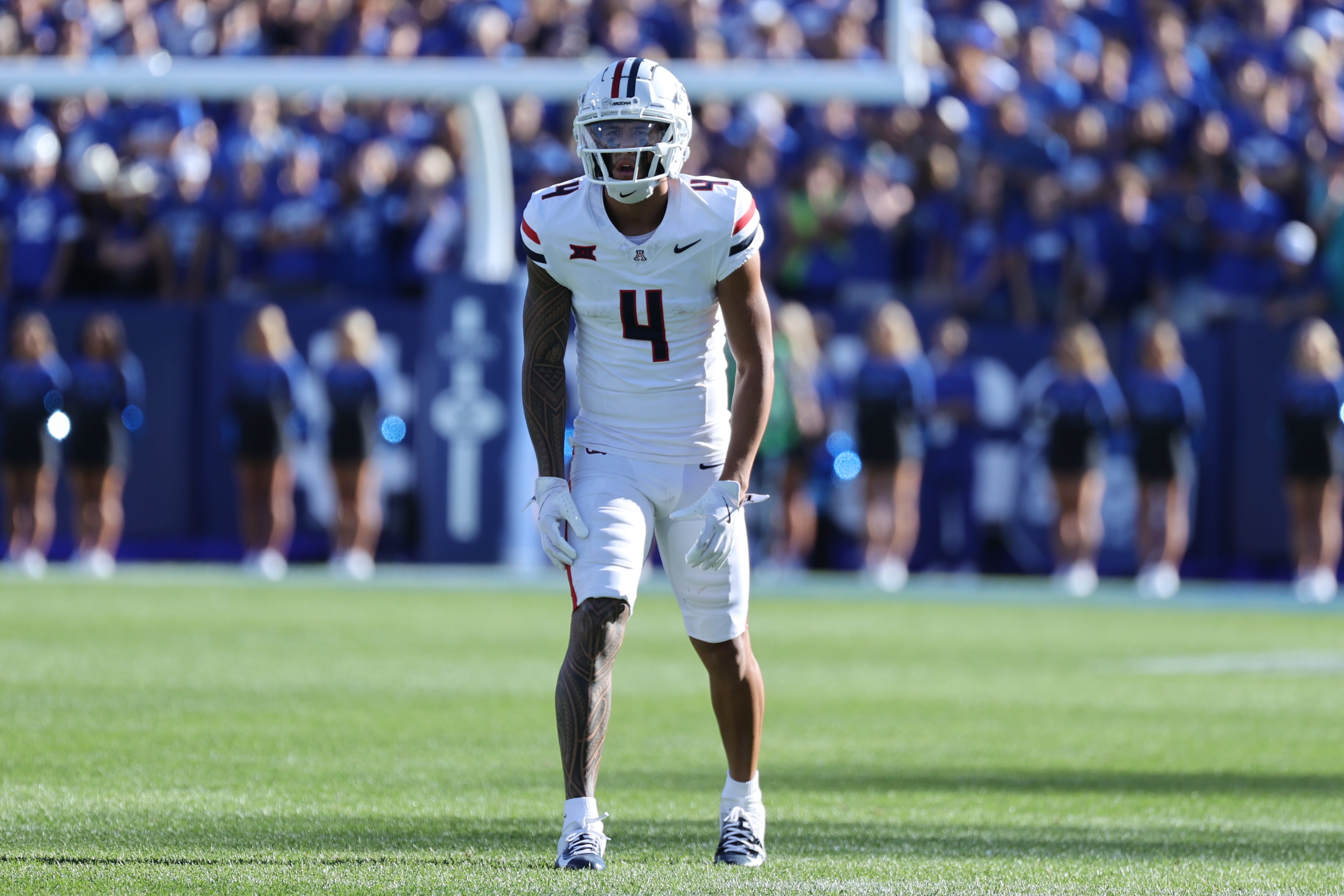 Arizona Wildcats wide receiver Tetairoa McMillan (4) gets ready for a play against the Brigham Young Cougars during the third quarter at LaVell Edwards Stadium.