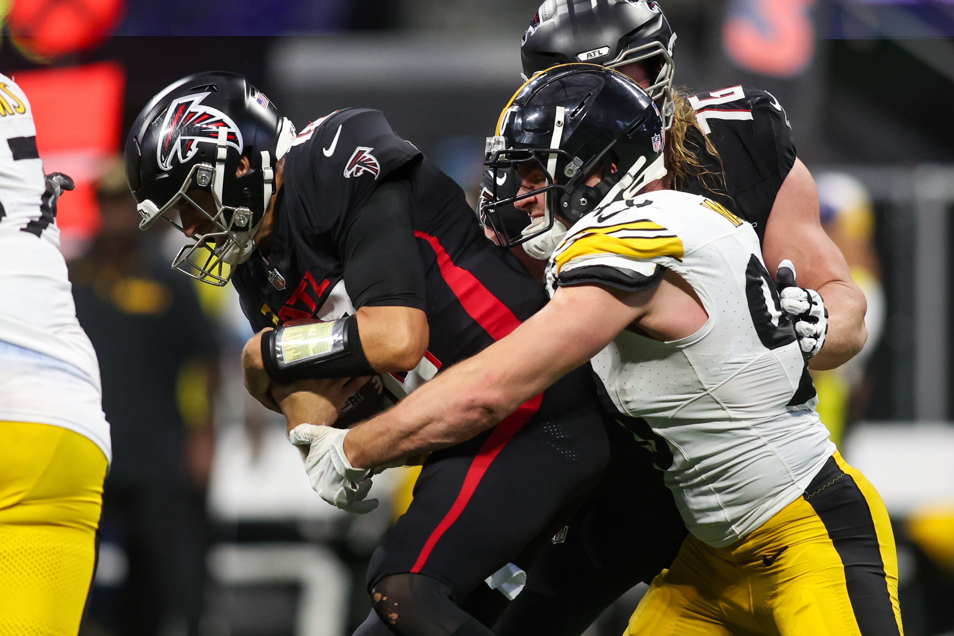 Sep 8, 2024; Atlanta, Georgia, USA; Pittsburgh Steelers linebacker T.J. Watt (90) sacks Atlanta Falcons quarterback Kirk Cousins (18) in the fourth quarter at Mercedes-Benz Stadium.