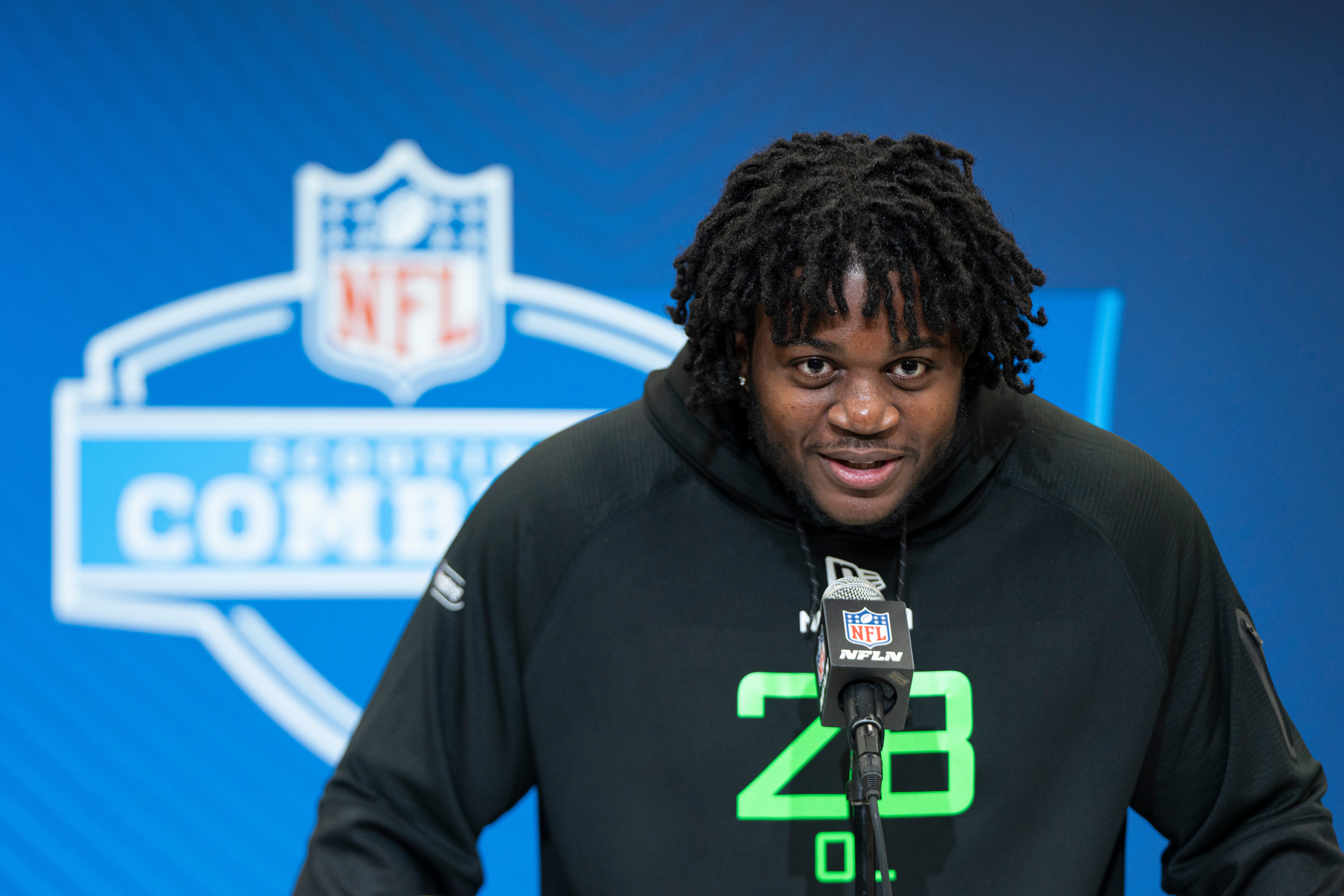 University of Missouri offensive lineman Armand Membou (OL28) answers questions at a press conference during the 2025 NFL Combine at Indiana Convention Center.