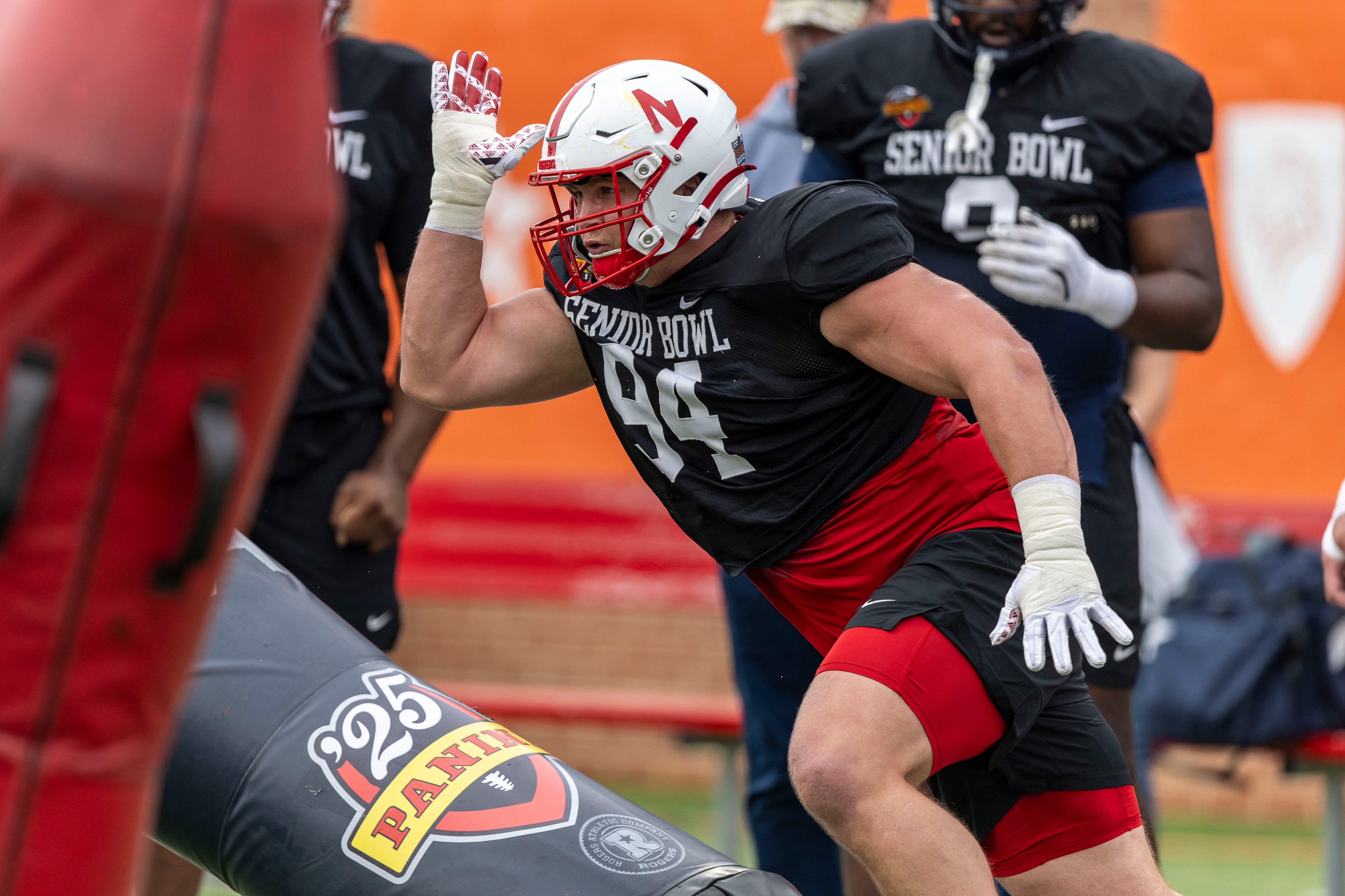 Jan 30, 2025; Mobile, AL, USA; National team defensive lineman Ty Robinson of Nebraska (94) works through drills during Senior Bowl practice for the National team at Hancock Whitney Stadium.