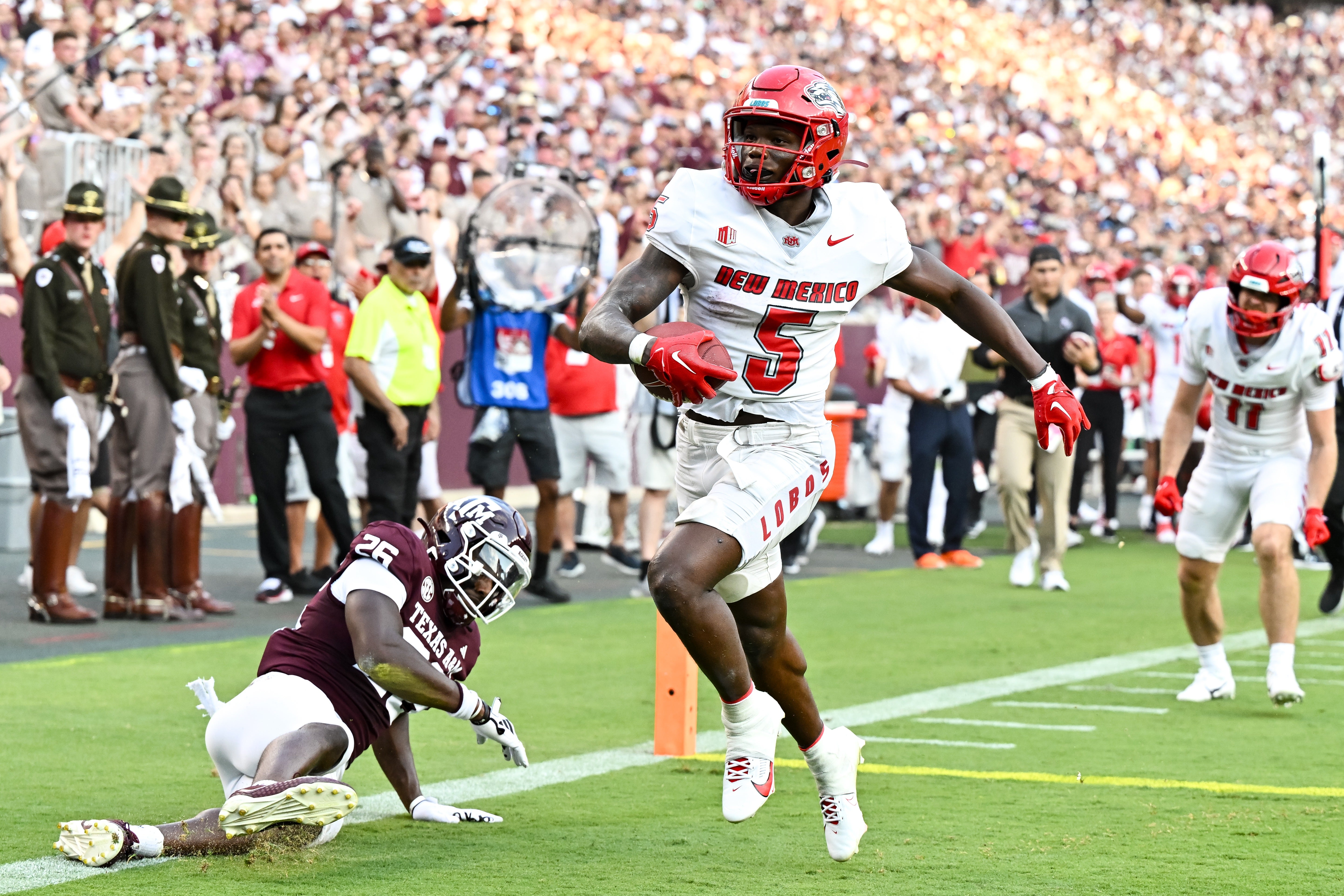 Sep 2, 2023; College Station, Texas, USA; New Mexico Lobos running back Jacory Croskey-Merritt (5) runs the ball in for a touchdown during the second quarter against the Texas A&M Aggies at Kyle Field.