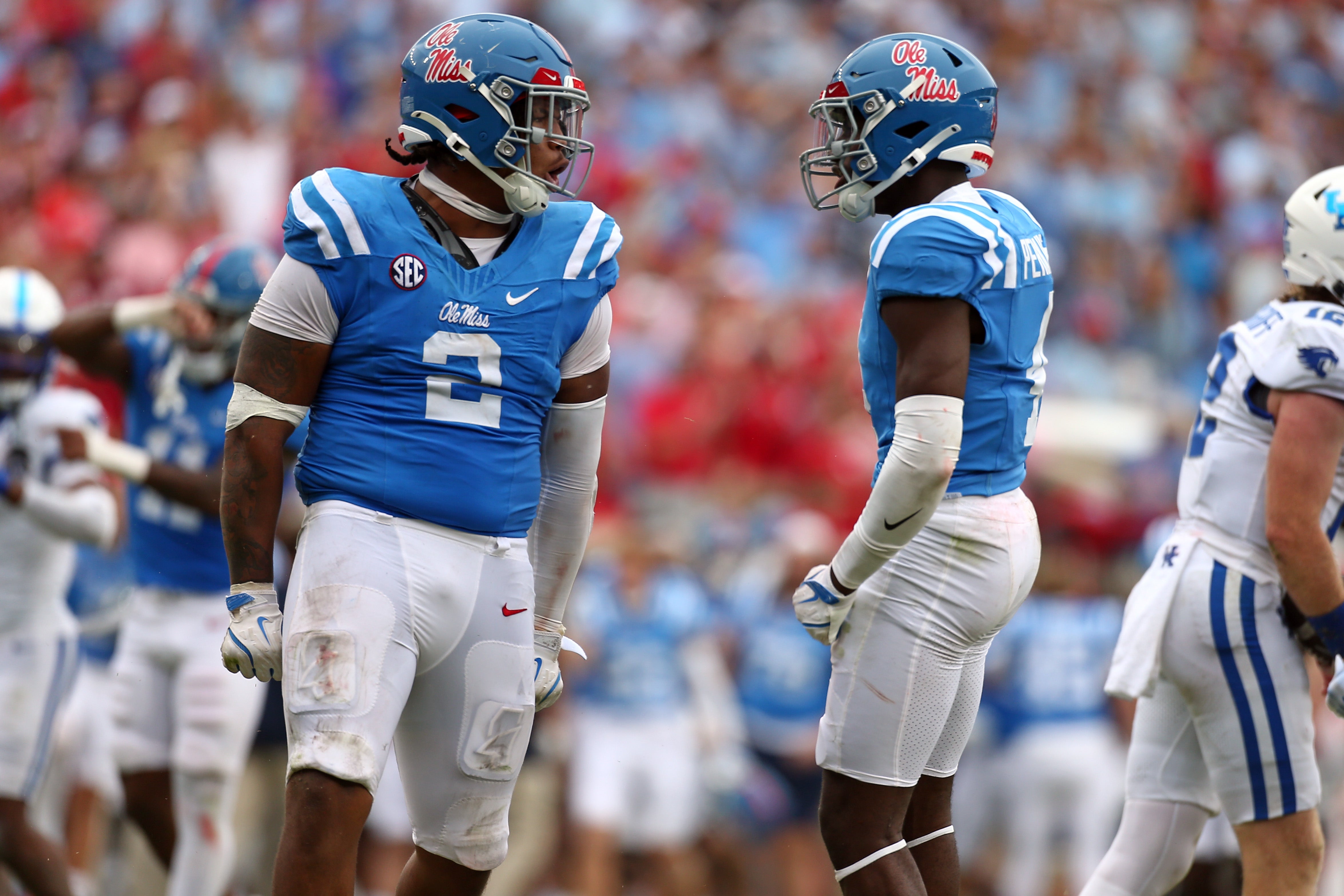 Sep 28, 2024; Oxford, Mississippi, USA; Mississippi Rebels defensive linemen Walter Nolen (2) and linebacker Suntarine Perkins (4) react after a sack during the second half against the Kentucky Wildcats at Vaught-Hemingway Stadium. Mandatory Credit: Petre Thomas-Imagn Images