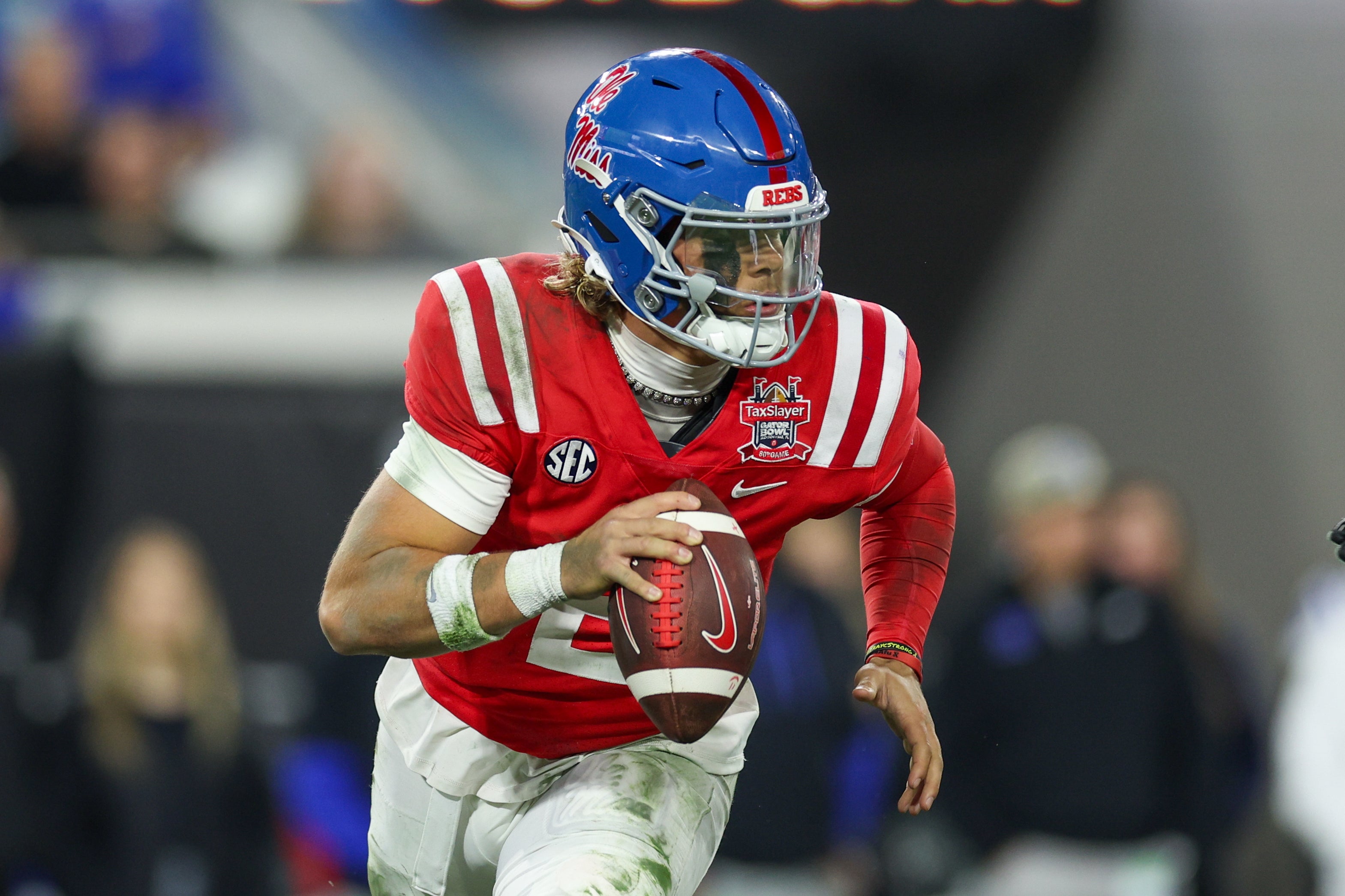 Jaxson Dart, QB Ole Miss rolls out to make a play for the Rebels