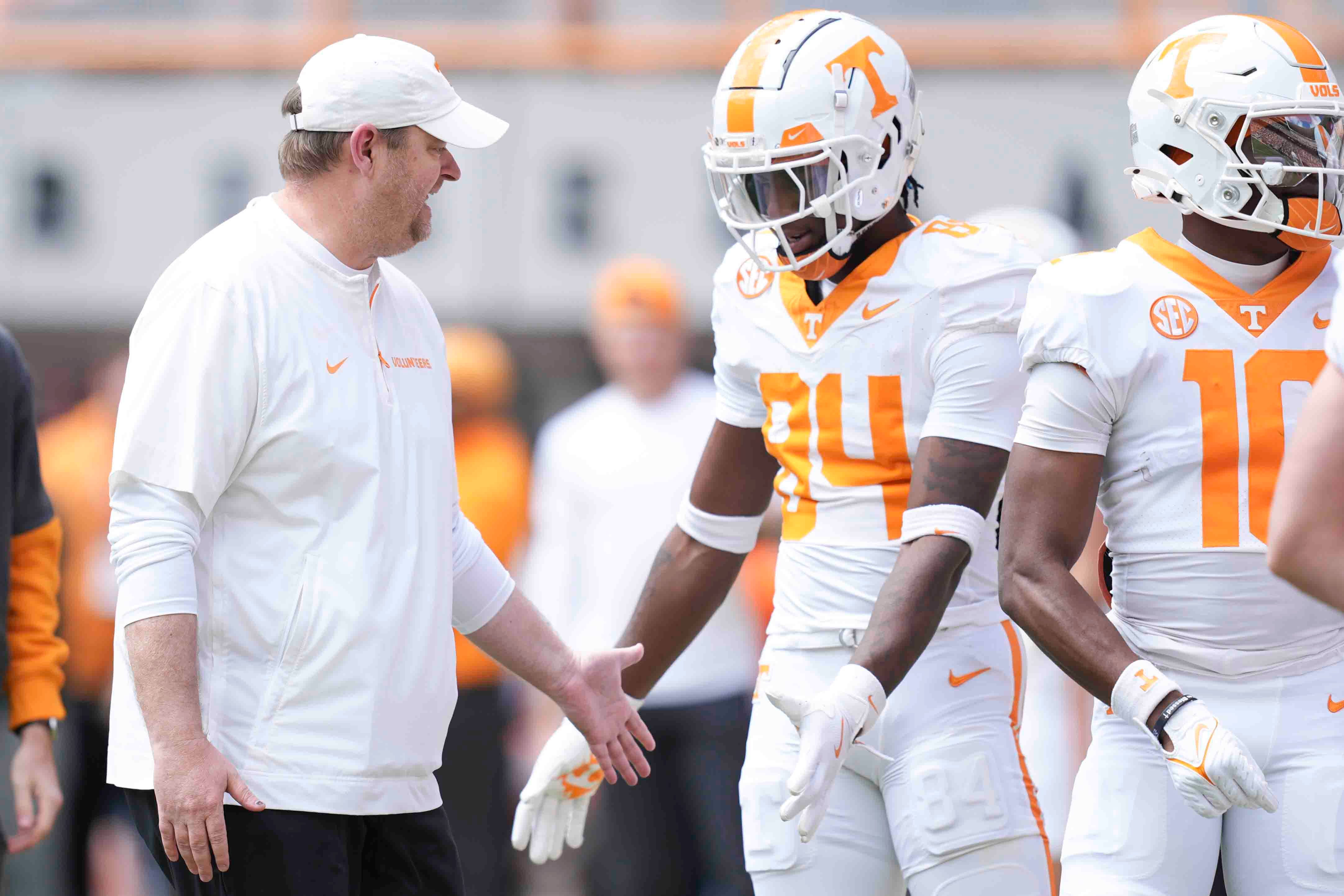 Tennessee head coach Josh Heupel greets players during warms up before the Orange & White spring game, Saturday, April 12, 2025.