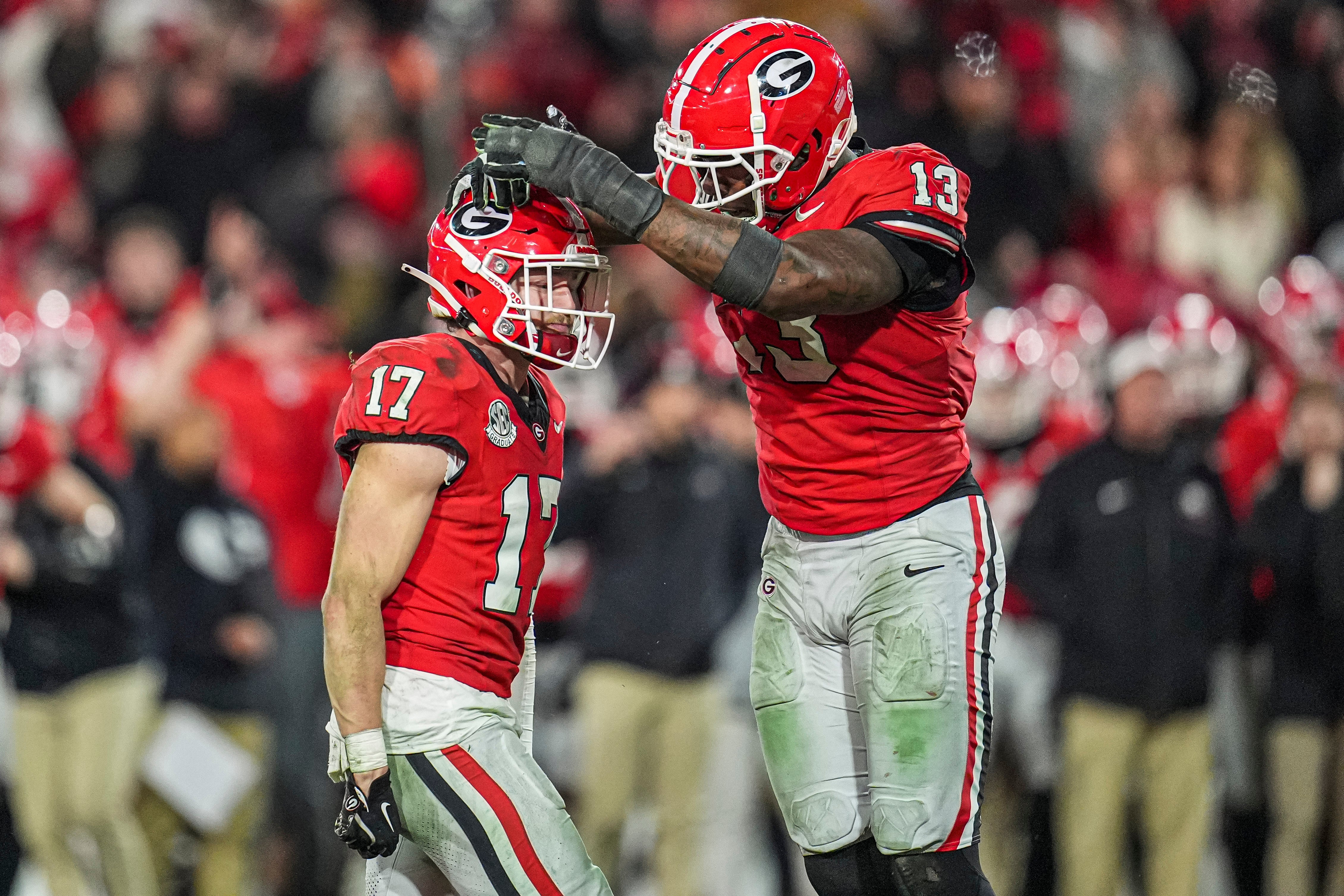 Georgia Bulldogs defensive back Dan Jackson (17) reacts with defensive lineman Mykel Williams (13) after sacking Georgia Tech Yellow Jackets quarterback Haynes King (10) (not pictured) during overtime.