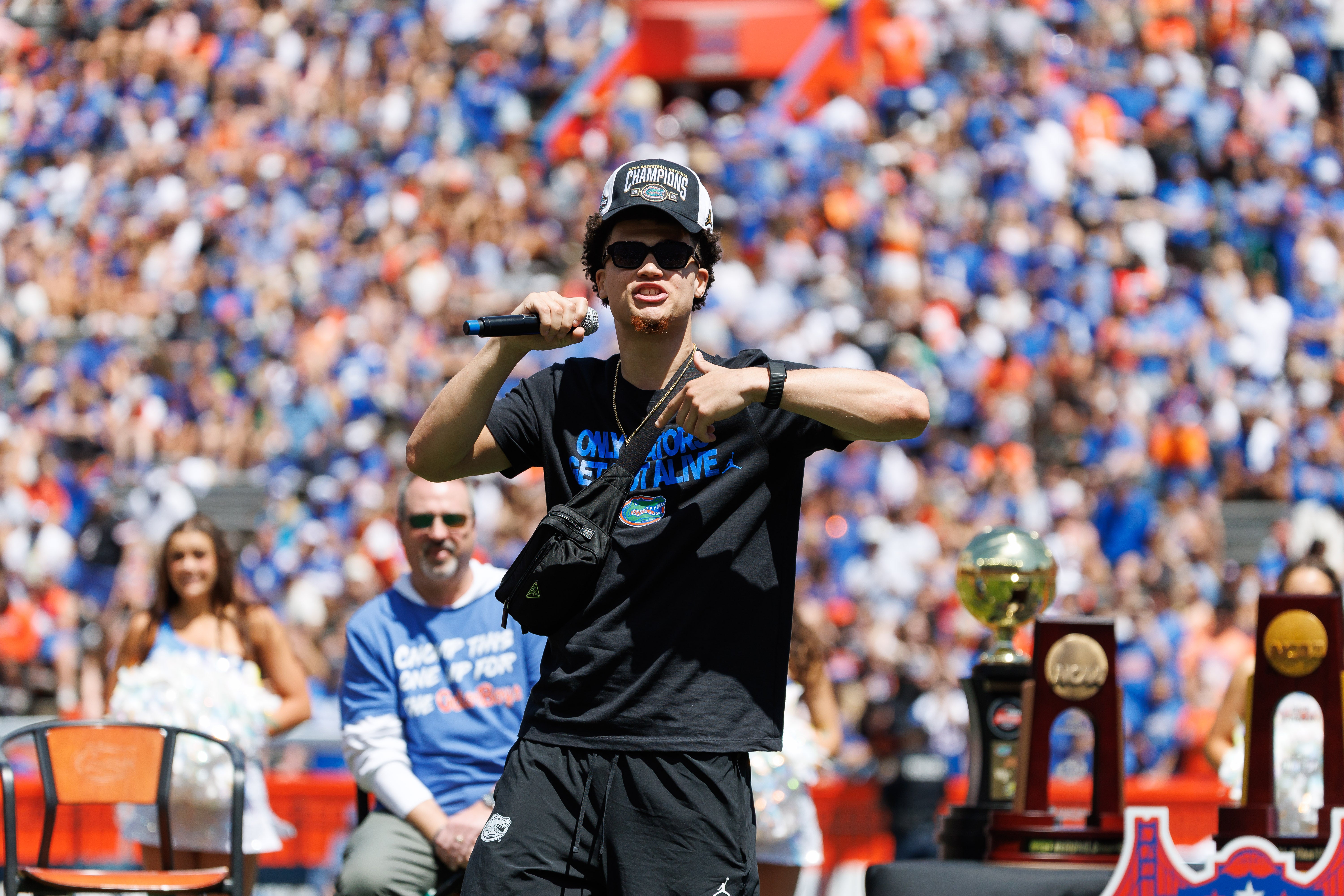 Apr 12, 2025; Gainesville, FL, USA; Florida Gators guard Walter Clayton Jr. (1) addresses the crowd during the National Championship celebration at Ben Hill Griffin Stadium.