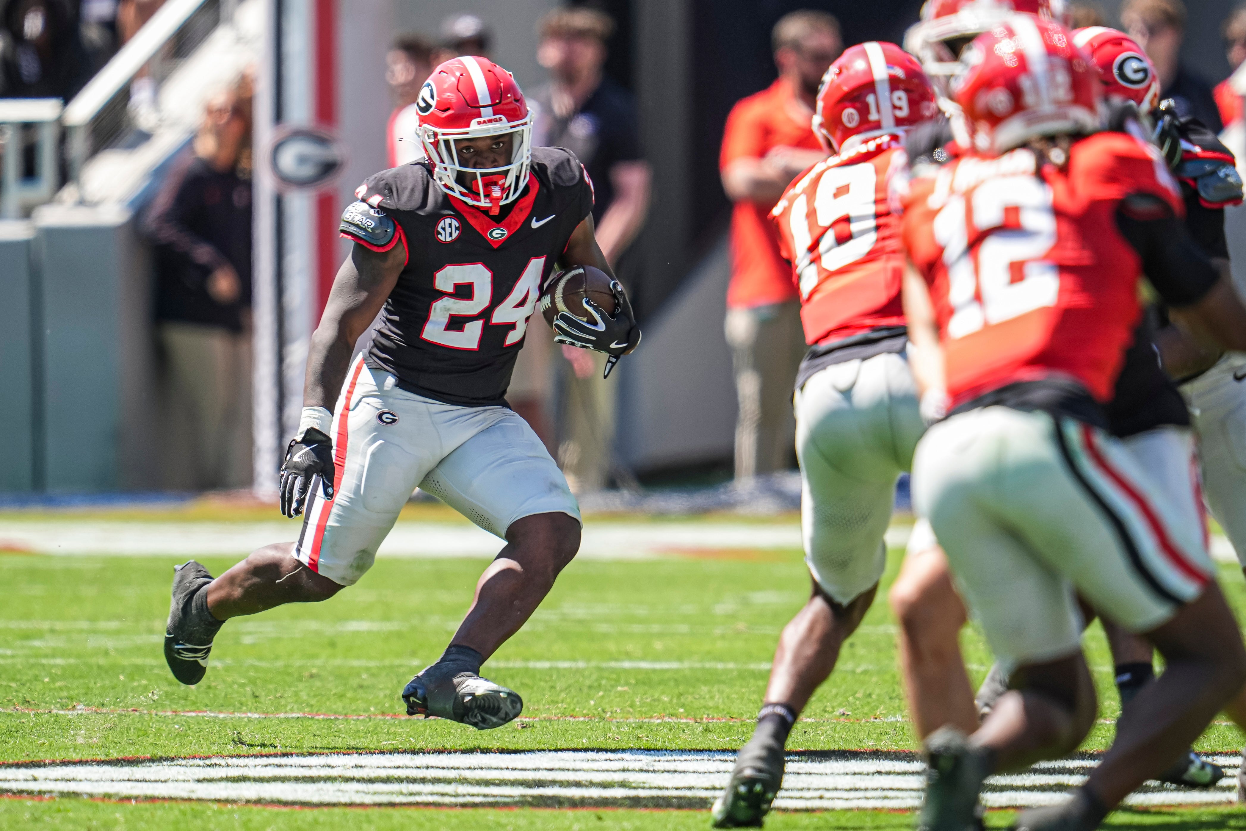 Georgia Bulldogs running back Bo Walker (24) runs with the ball during the Georgia Spring game at Sanford Stadium.