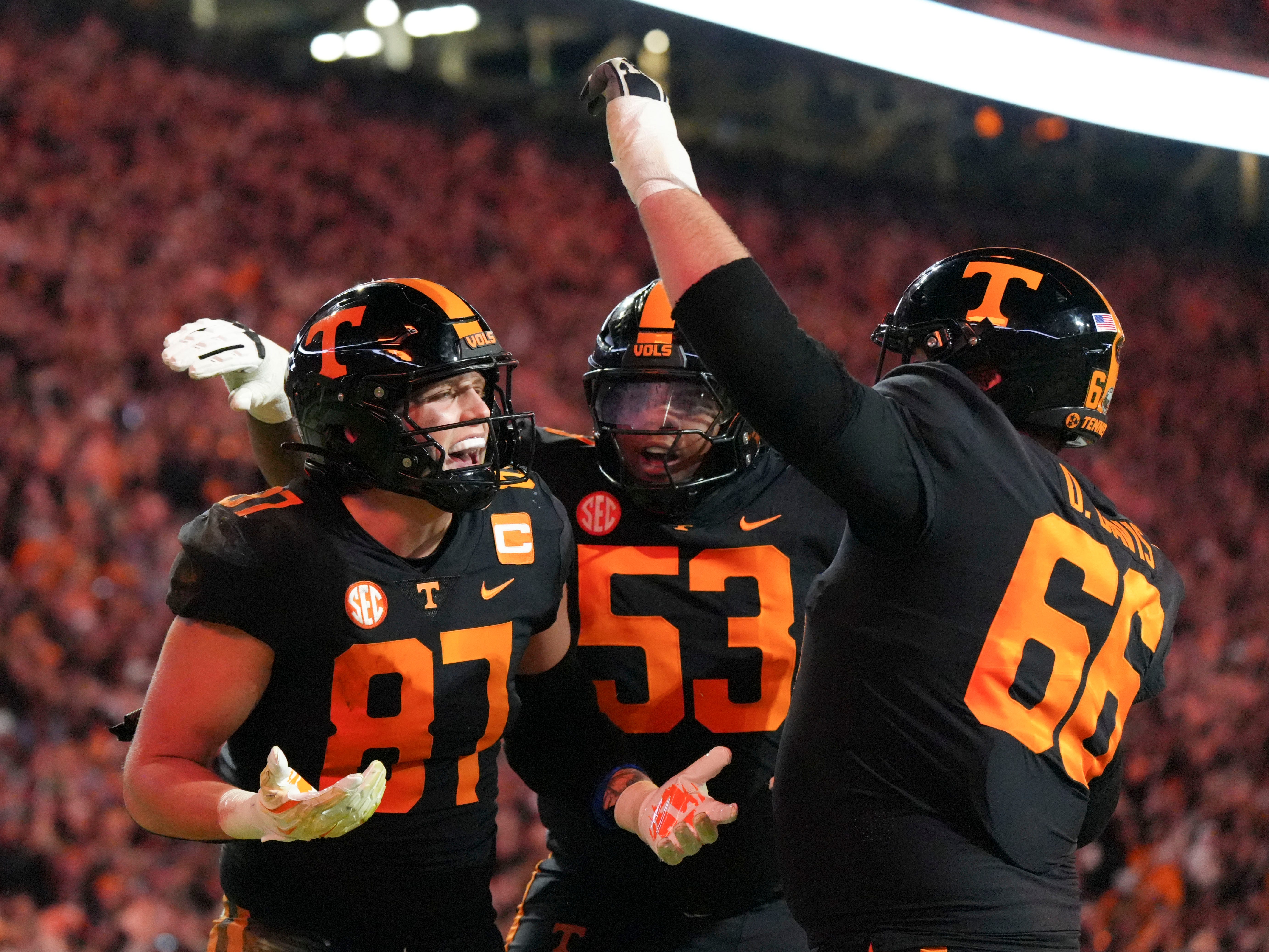 Tennessee tight end Miles Kitselman (87) celebrating his touchdown with Tennessee offensive linemen Lance Heard (53) and Dayne Davis (66) during an NCAA college football game between Tennessee and Kentucky on Saturday, Nov. 2, 2024, in Knoxville, Tenn.