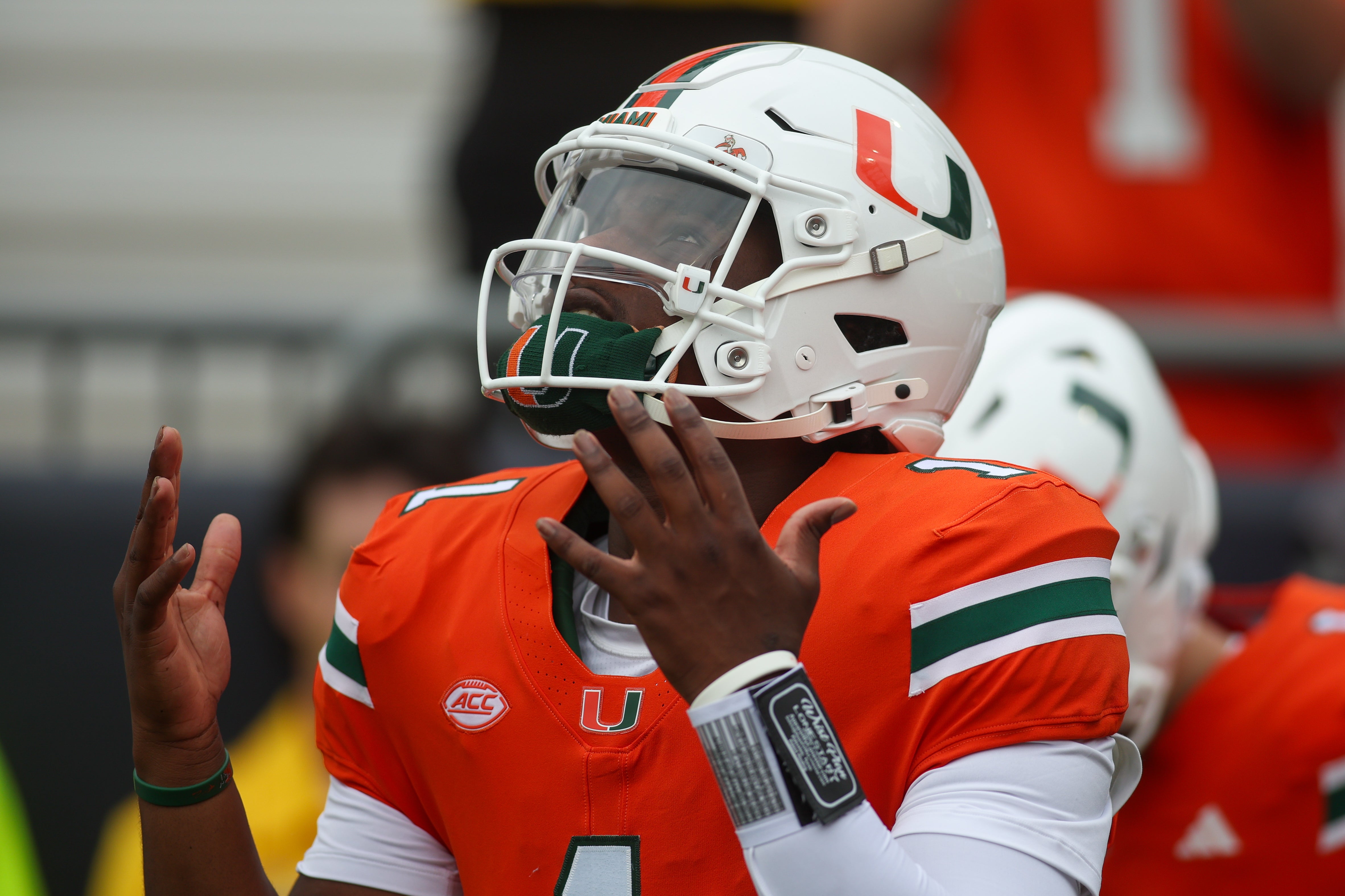 Nov 9, 2024; Atlanta, Georgia, USA; Miami Hurricanes quarterback Cam Ward (1) runs on the field before a game against the Georgia Tech Yellow Jackets at Bobby Dodd Stadium at Hyundai Field. Mandatory Credit: Brett Davis-Imagn Images