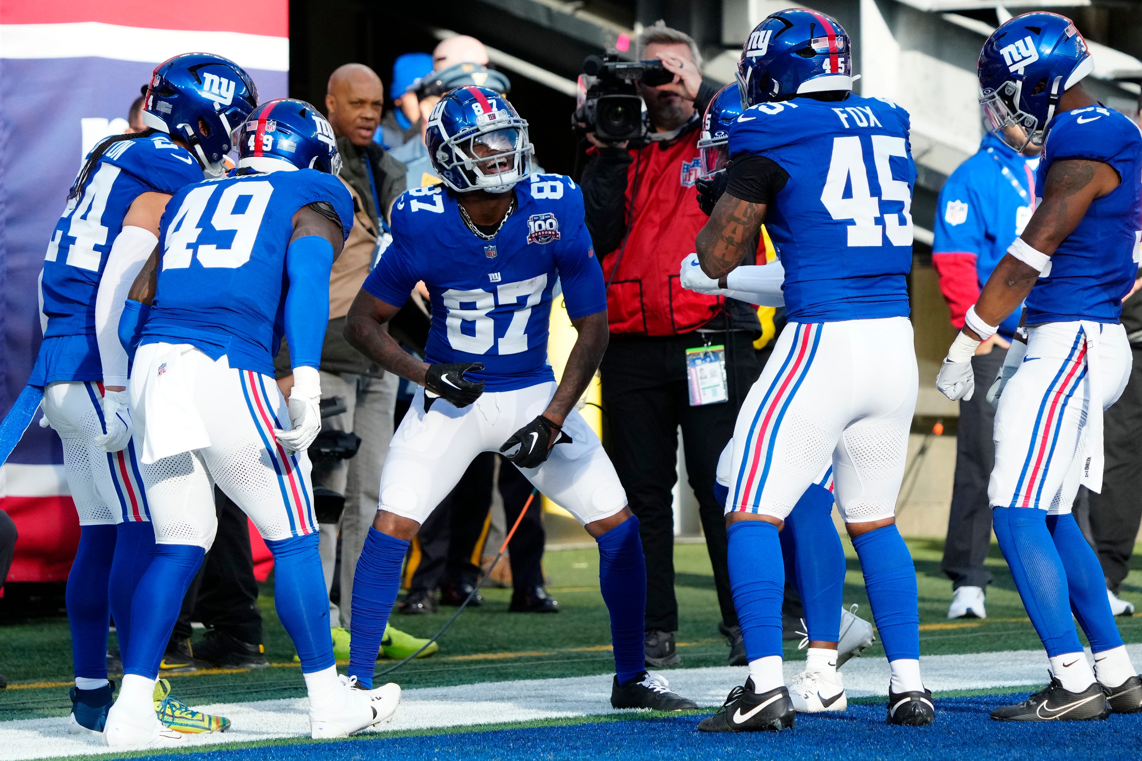 New York Giants wide receiver Ihmir Smith-Marsette (87) celebrates with his teammates in the end zone when they were under the impression he had just scored a touchdown. However, the ball was called back due to a penalty.
