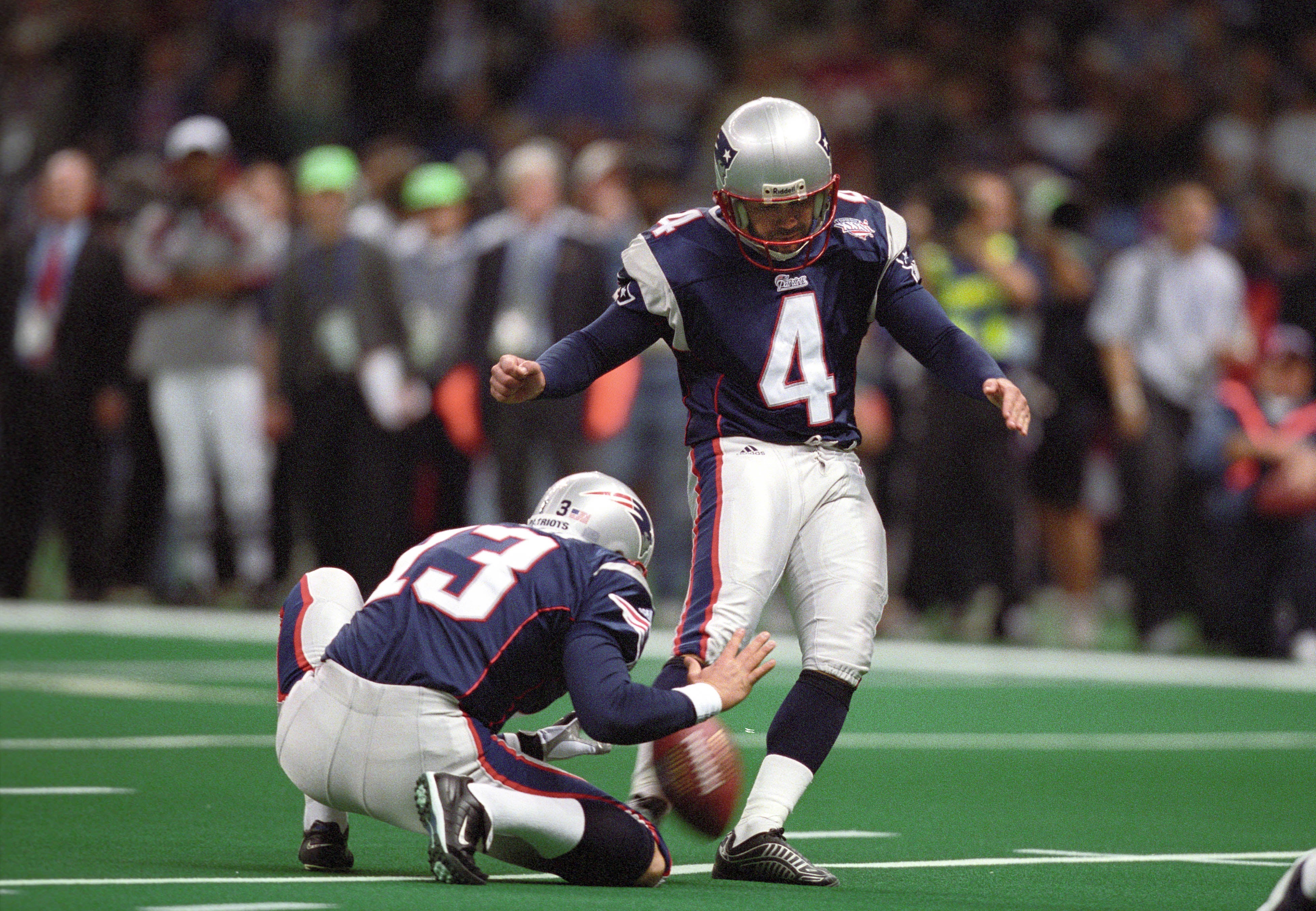 Feb 3, 2002; New Orleans, LA, USA; New England Patriots kicker Adam Vinatieri (4) kicks the ball against the St. Louis Rams during Super Bowl XXXVI at the Louisiana Superdome. The Patriots defeated the Rams 20-17.