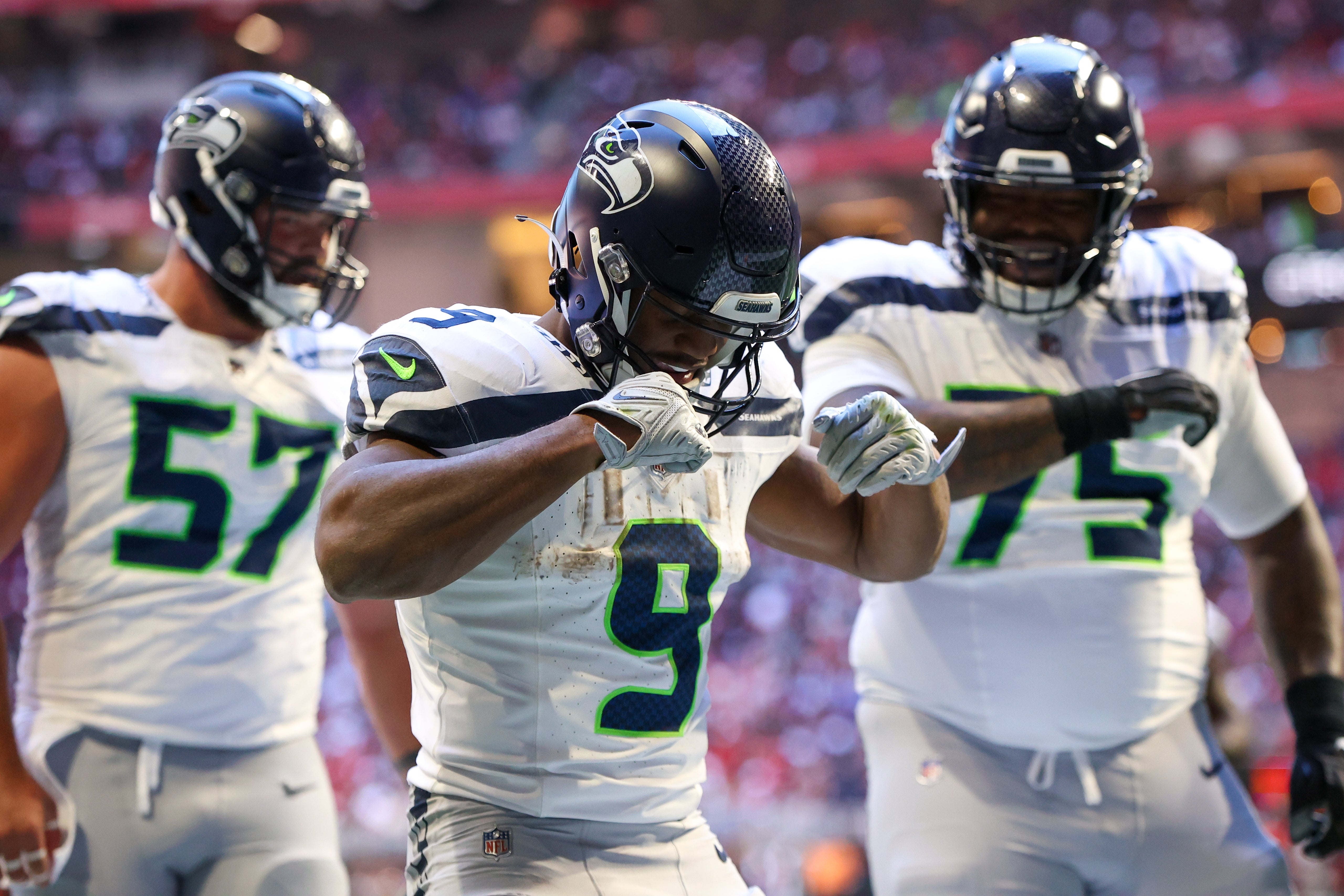 Oct 20, 2024; Atlanta, Georgia, USA; Seattle Seahawks running back Kenneth Walker III (9) celebrates after a touchdown catch against the Atlanta Falcons in the third quarter at Mercedes-Benz Stadium.