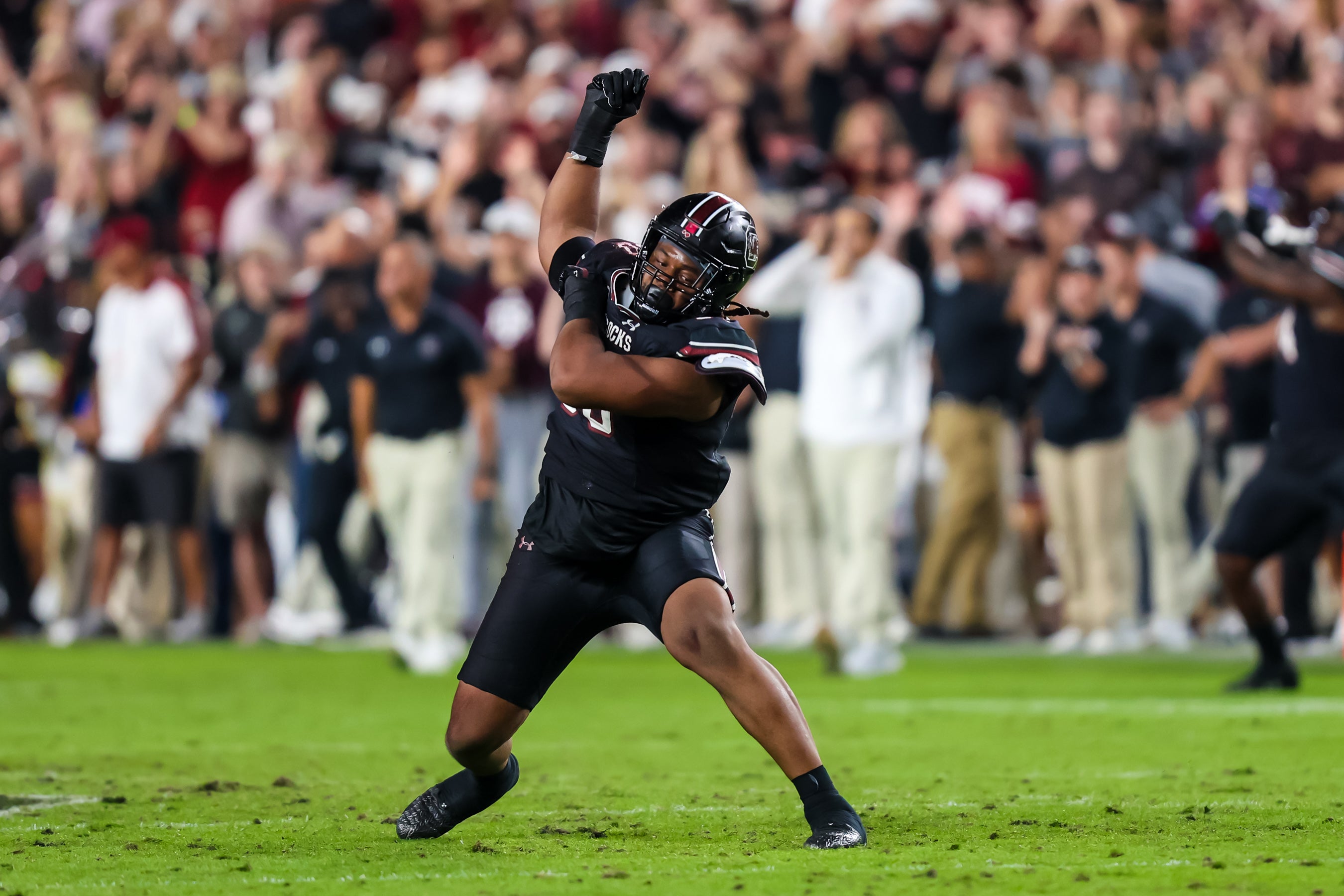 Nov 2, 2024; Columbia, South Carolina, USA; South Carolina Gamecocks defensive tackle T.J. Sanders (90) celebrates a stop against the Texas A&M Aggies in the second half at Williams-Brice Stadium.