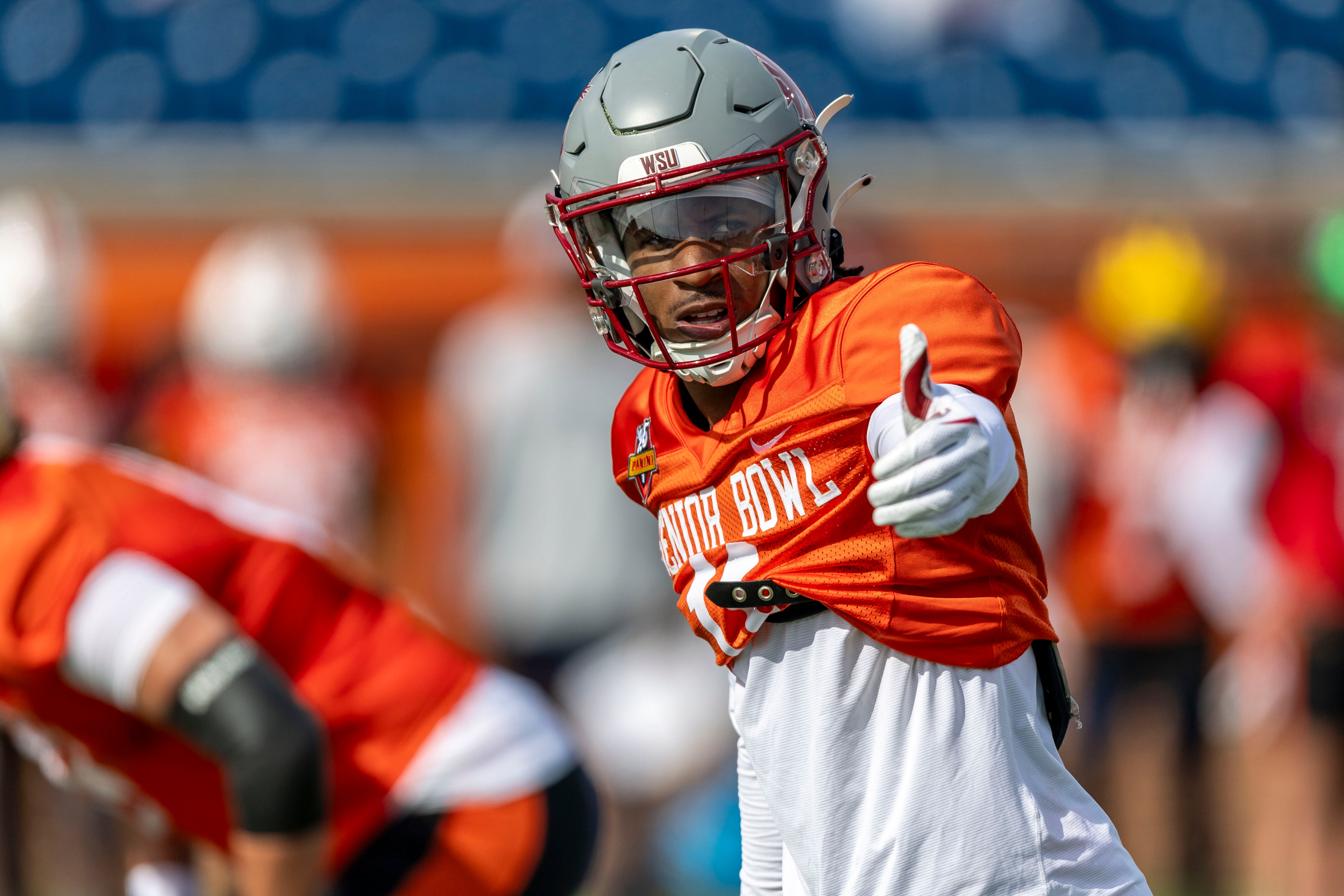 Jan 28, 2025; Mobile, AL, USA; National team wide receiver Kyle Williams of Washington State (11) sets up at the line during Senior Bowl practice for the National team at Hancock Whitney Stadium.