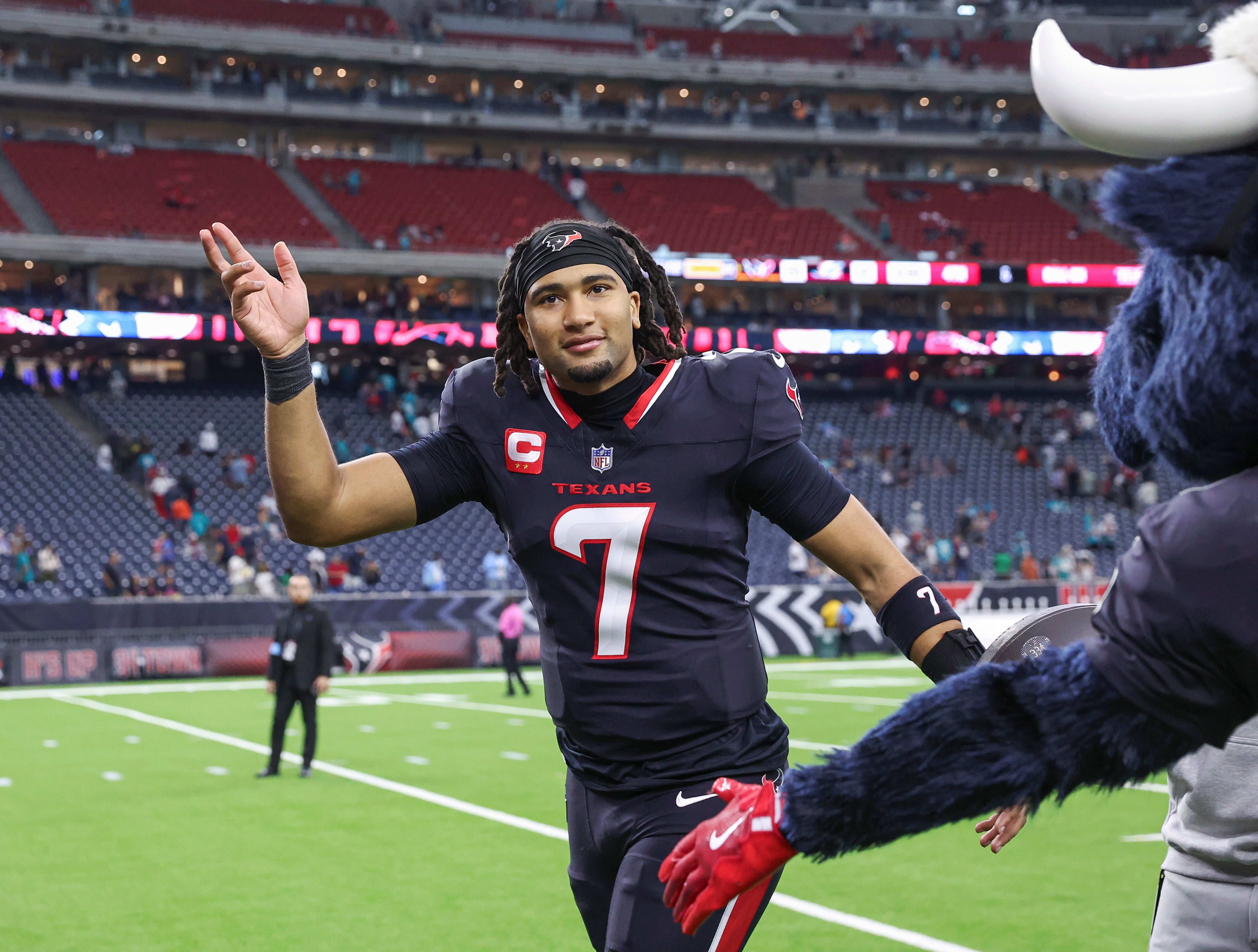 Dec 15, 2024; Houston, Texas, USA; Houston Texans quarterback C.J. Stroud (7) waves while jogging off the field after the game against the Miami Dolphins at NRG Stadium.