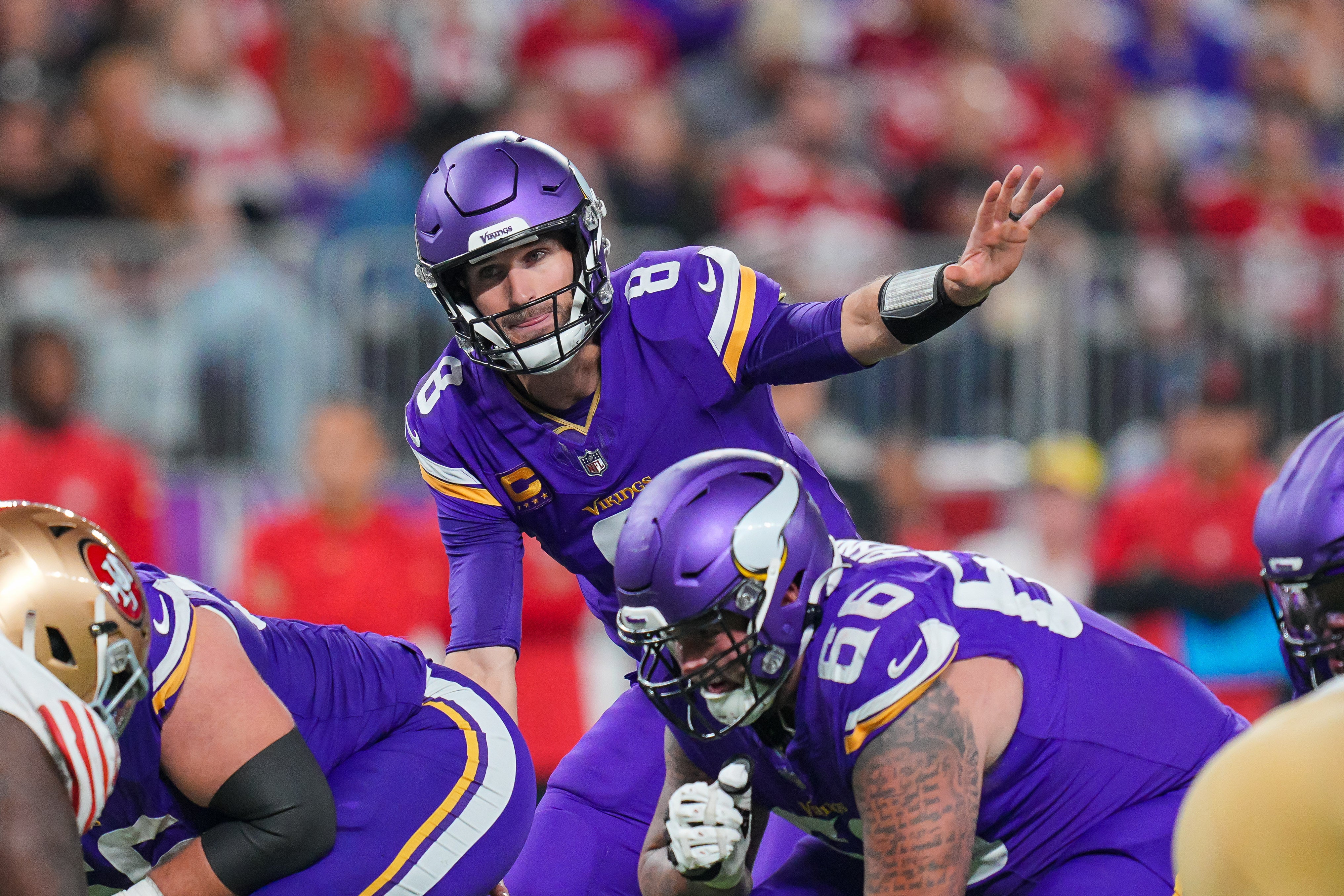 Oct 23, 2023; Minneapolis, Minnesota, USA; Minnesota Vikings quarterback Kirk Cousins (8) signals his team against the San Francisco 49ers in the third quarter at U.S. Bank Stadium.