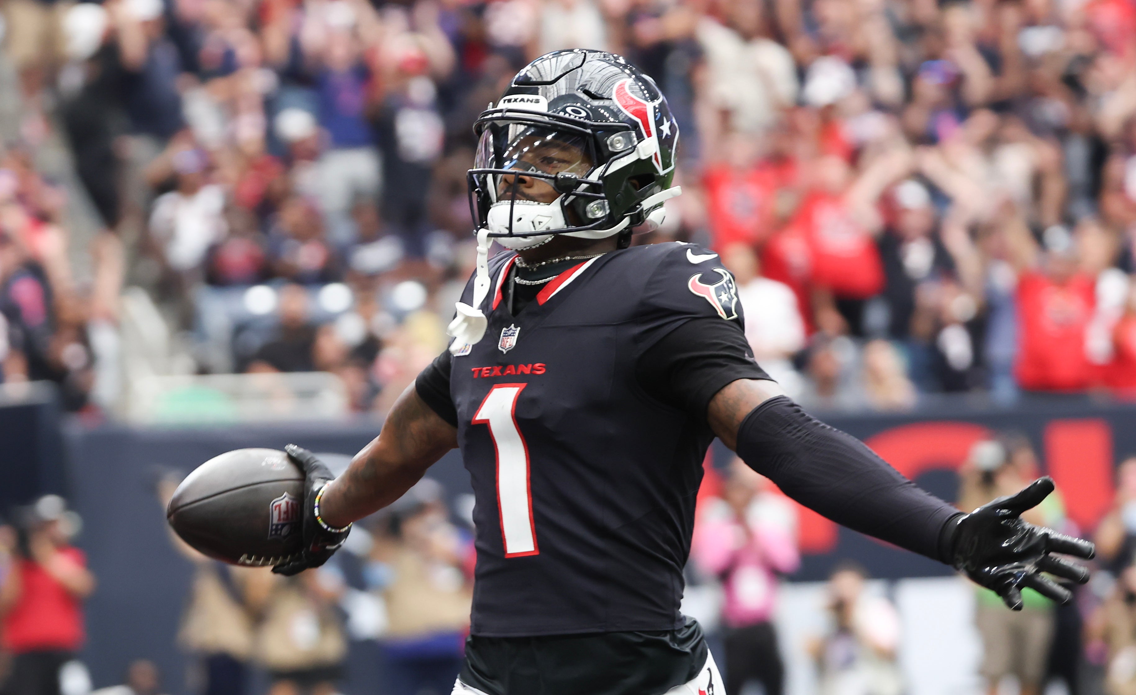 Sep 29, 2024; Houston, Texas, USA; Houston Texans wide receiver Stefon Diggs (1) scores against the Jacksonville Jaguars in the first quarter at NRG Stadium.