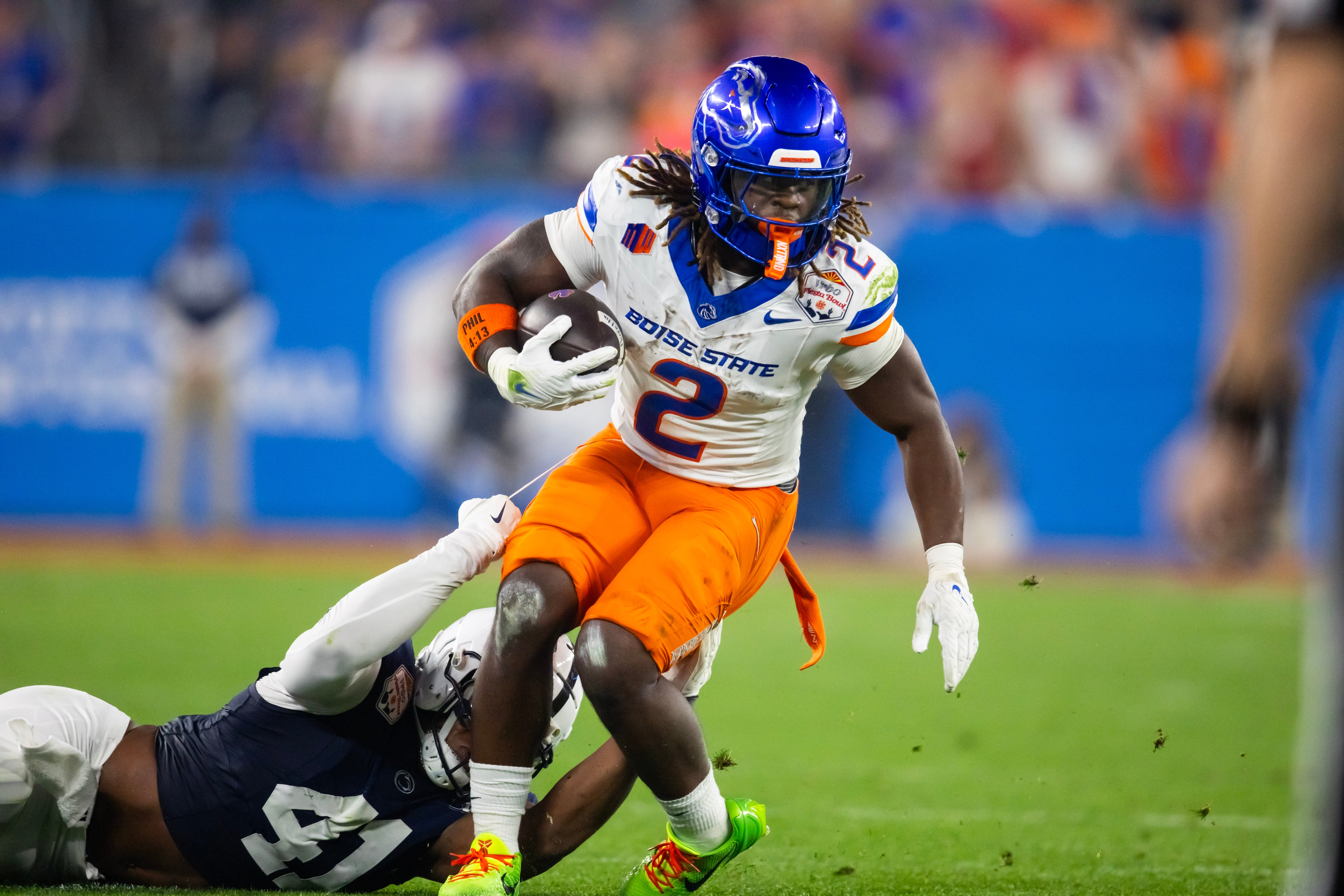 Dec 31, 2024; Glendale, AZ, USA; Boise State Broncos running back Ashton Jeanty (2) against the Penn State Nittany Lions during the Fiesta Bowl at State Farm Stadium.