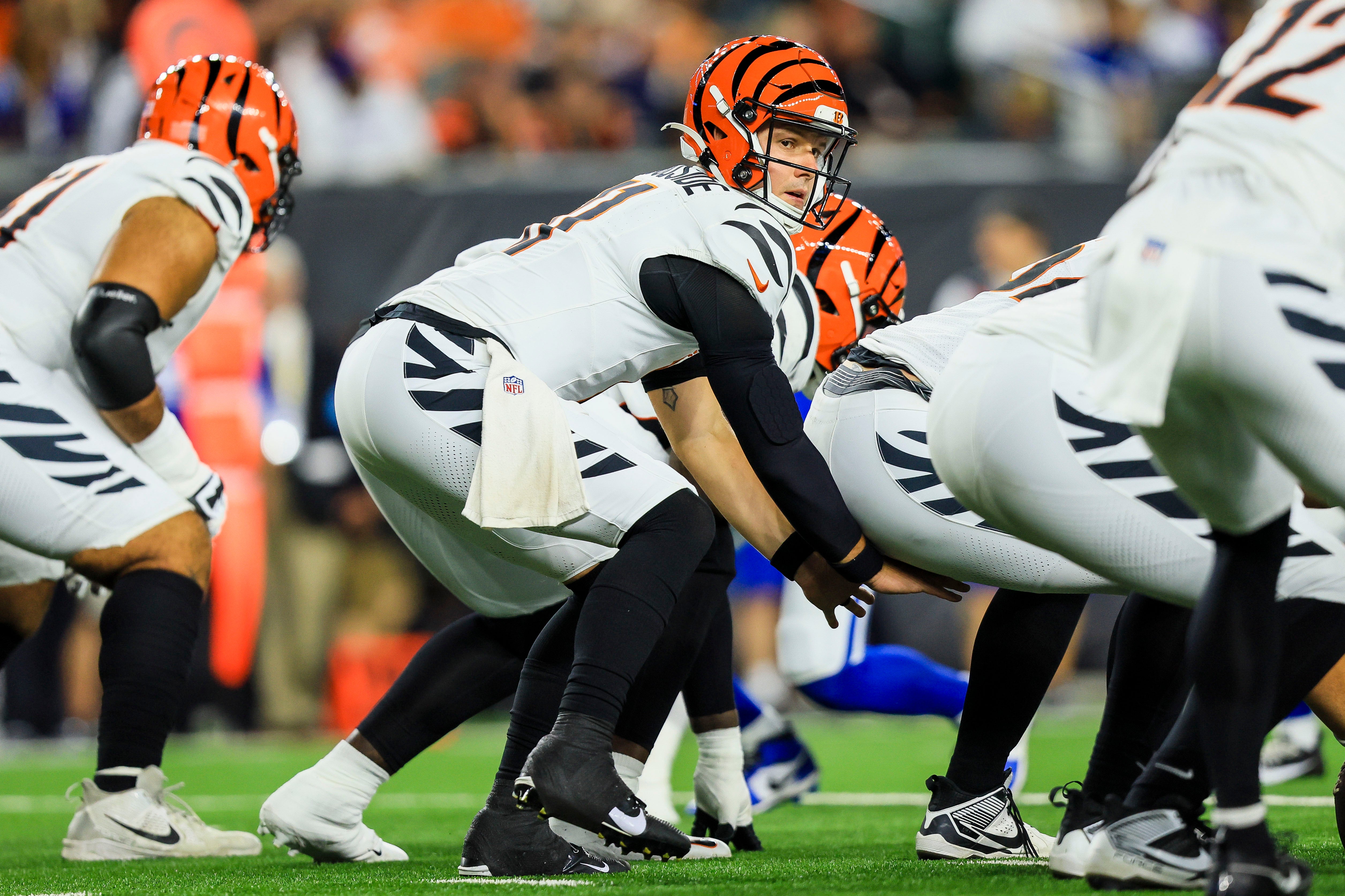 Aug 22, 2024; Cincinnati, Ohio, USA; Cincinnati Bengals quarterback Logan Woodside (11) prepares to snap the ball against the Indianapolis Colts in the first half at Paycor Stadium.