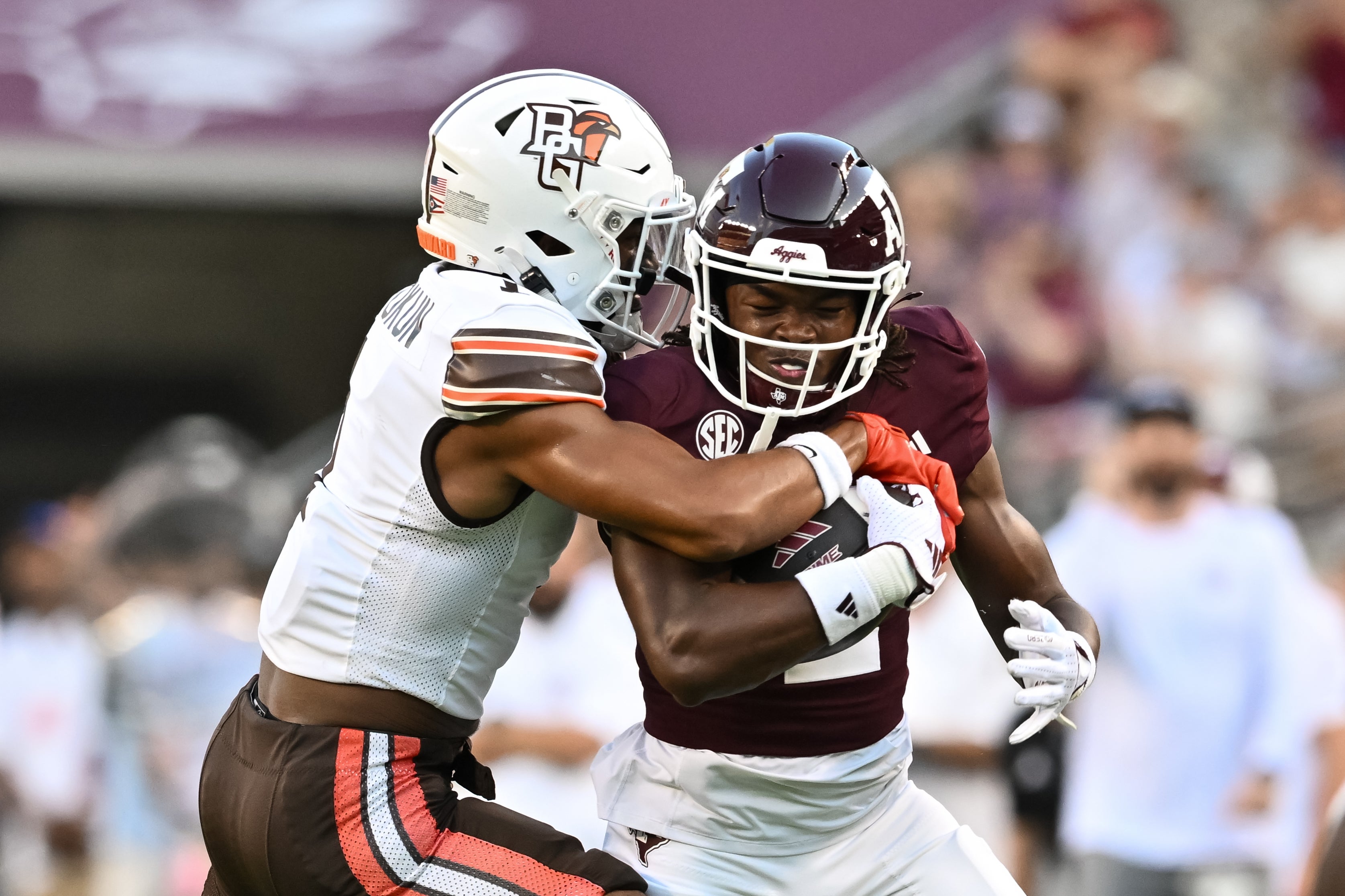 Sep 21, 2024; College Station, Texas, USA; Bowling Green Falcons cornerback Jordan Oladokun (1) tackles Texas A&M Aggies running back Rueben Owens (2) during the first quarter at Kyle Field.