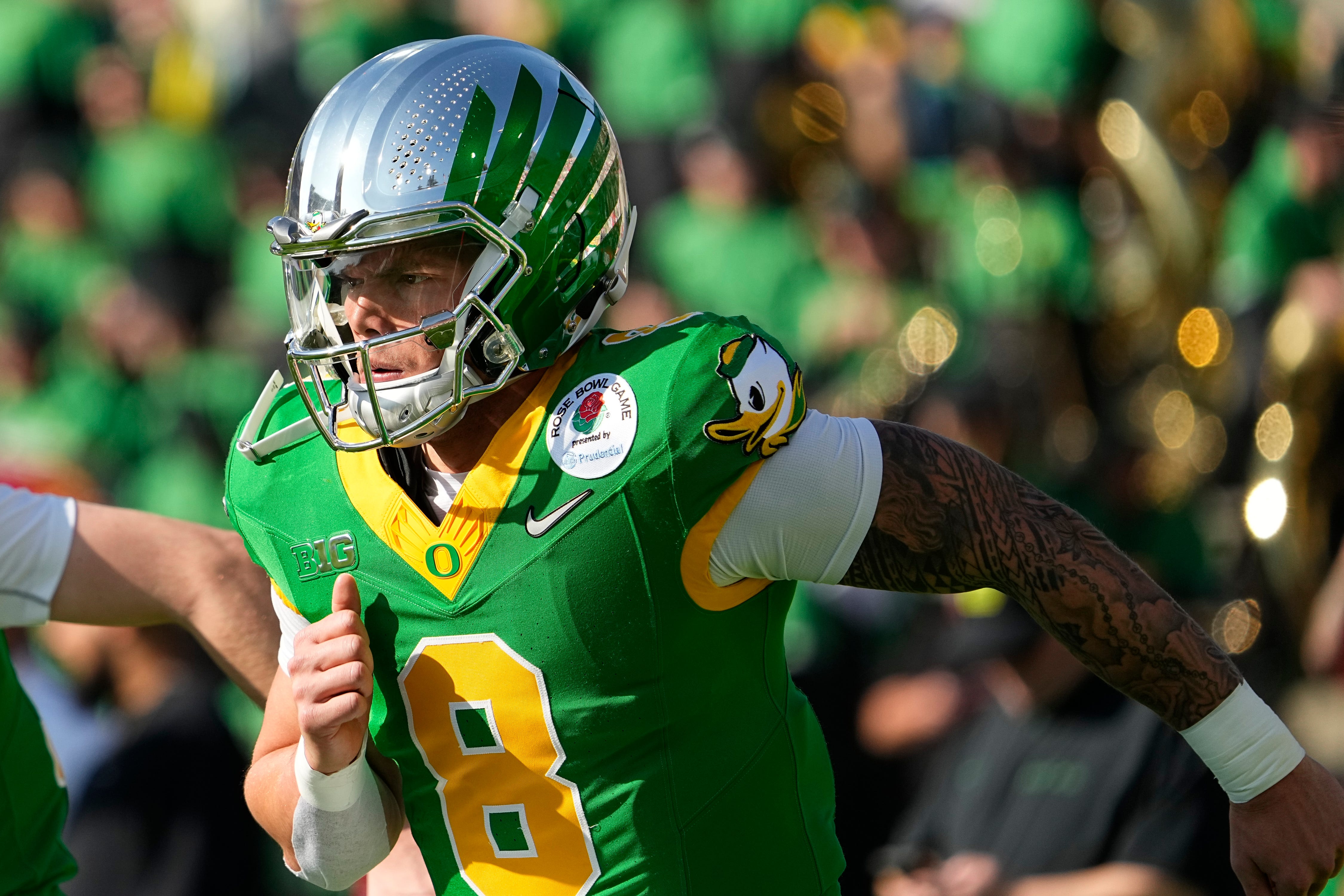 Dillon Gabriel, QB Oregon runs onto the field for the Ducks