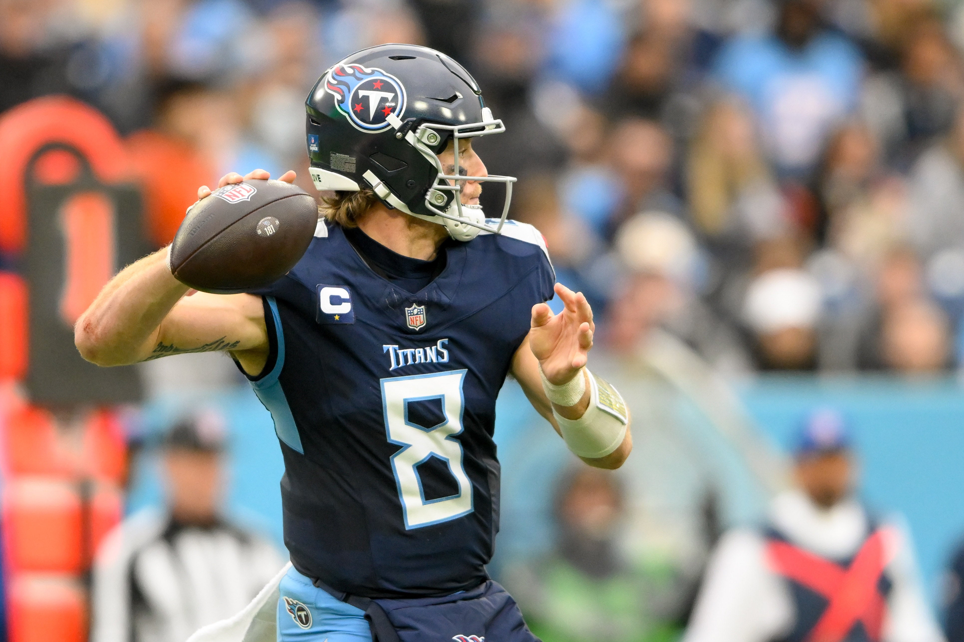 Dec 15, 2024; Nashville, Tennessee, USA; Tennessee Titans Will Levis (8) scrambles against the Cincinnati Bengals during the first half at Nissan Stadium. Mandatory Credit: Steve Roberts-Imagn Images