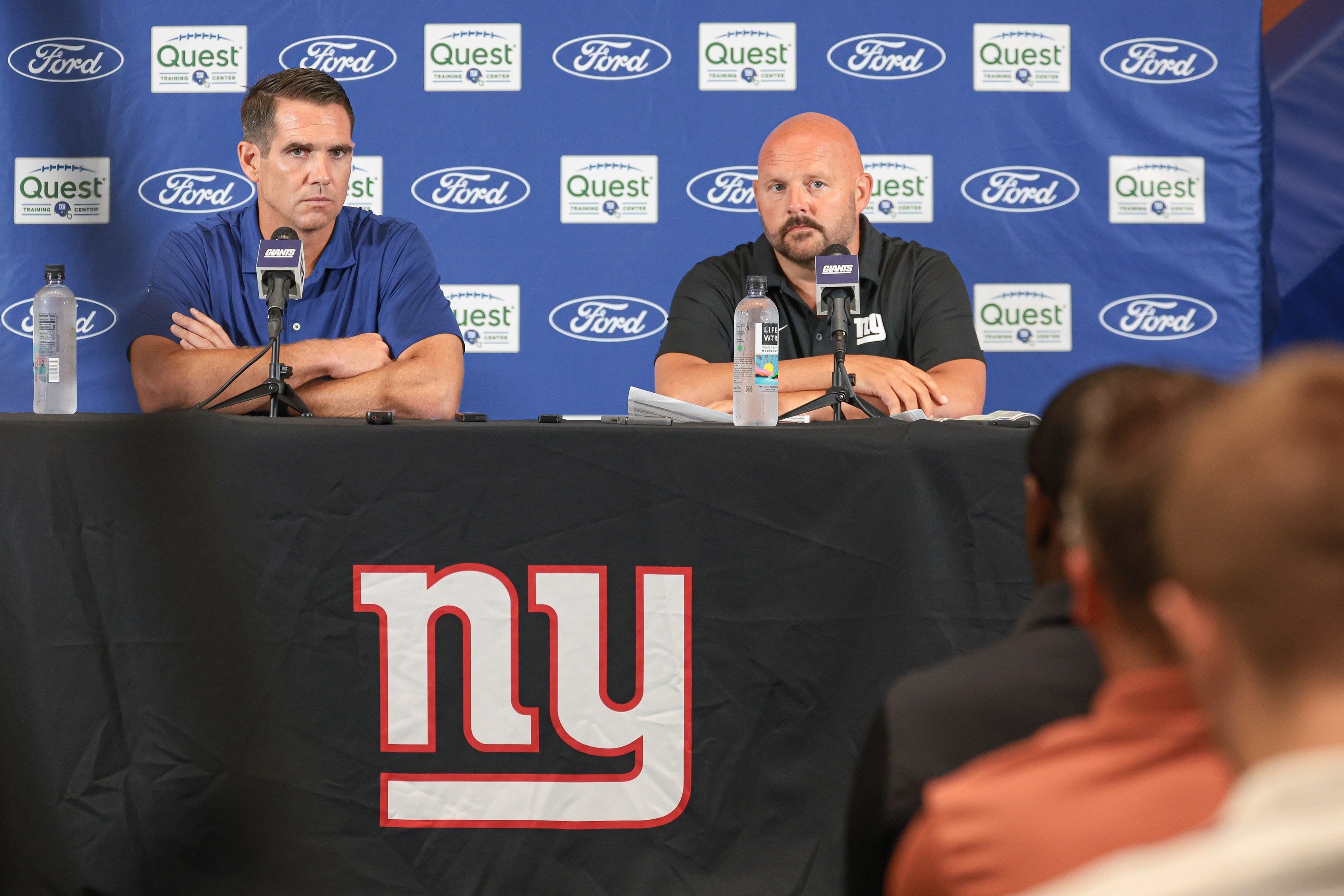 Jul 24, 2024; East Rutherford, NJ, USA; New York Giants general manager Joe Schoen (left) and head coach Brian Dabol talks to media before the start of training camp at Quest Diagnostics Training Facility.