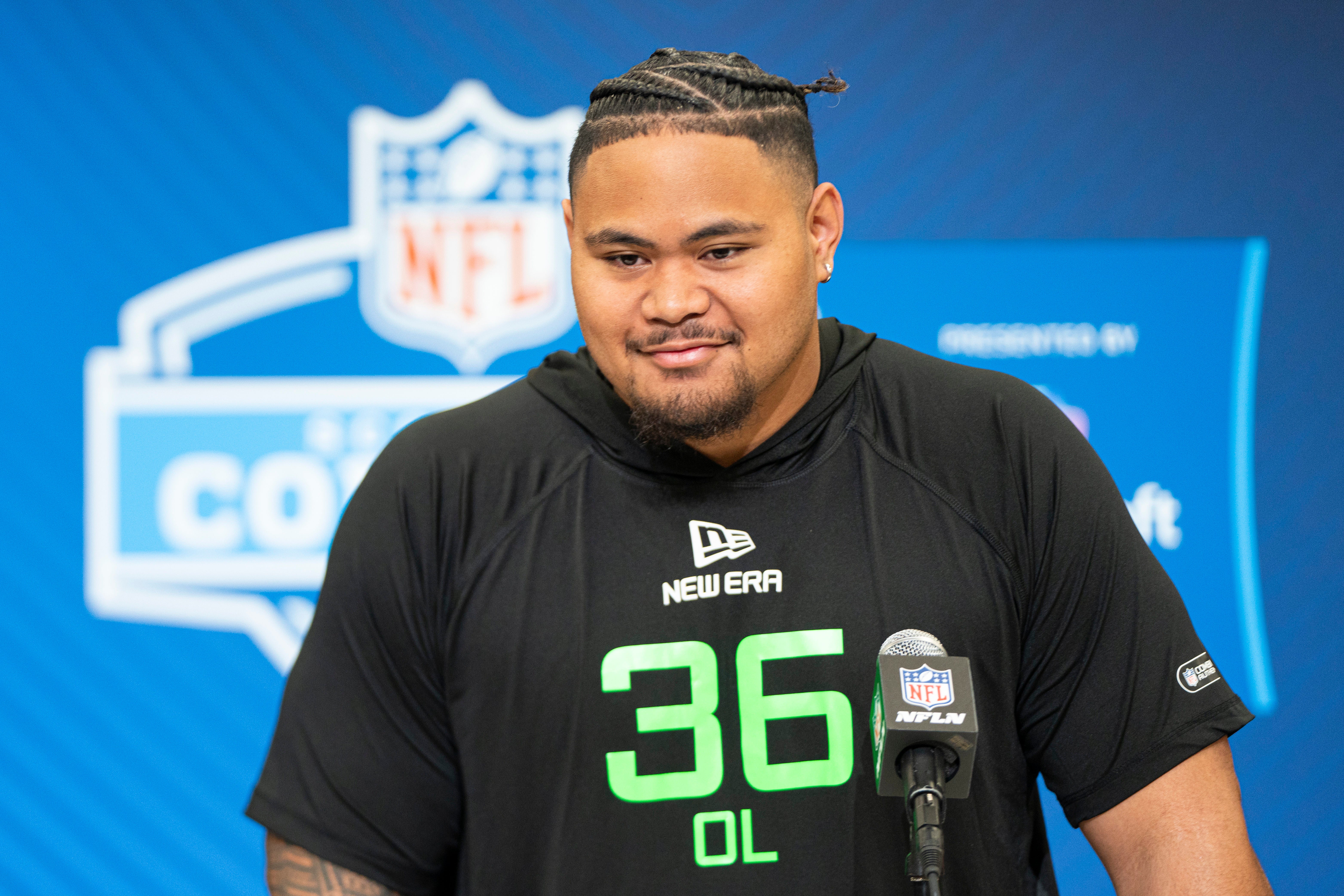 Mar 1, 2025; Indianapolis, IN, USA; University of Arizona offensive lineman Jonah Savaiinaea (OL36) answers questions at a press conference during the 2025 NFL Combine at Indiana Convention Center.