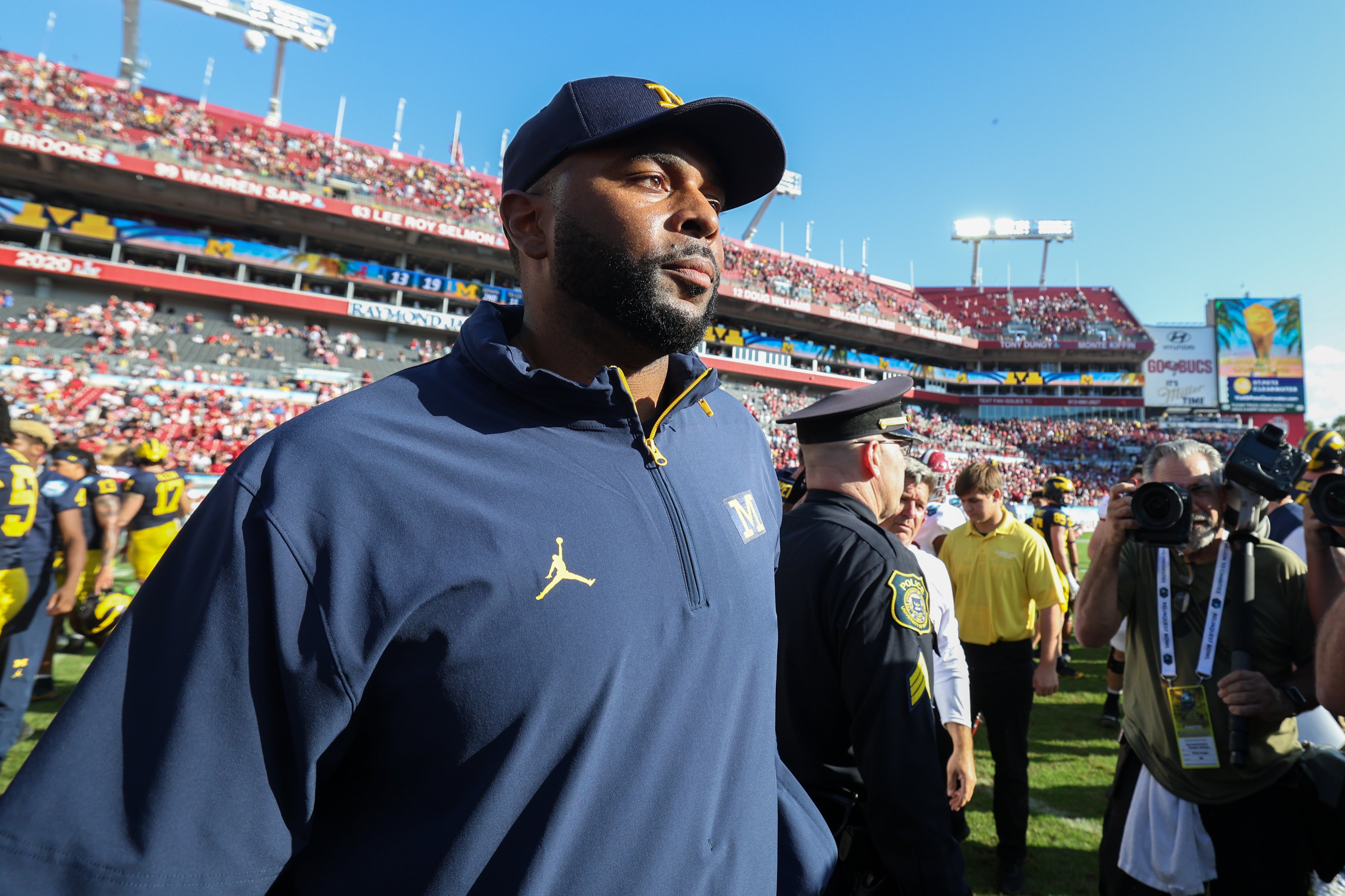 Dec 31, 2024; Tampa, FL, USA; Michigan Wolverines head coach Sherrone Moore celebrates after beating the Alabama Crimson Tide in the ReliaQuest Bowl at Raymond James Stadium.