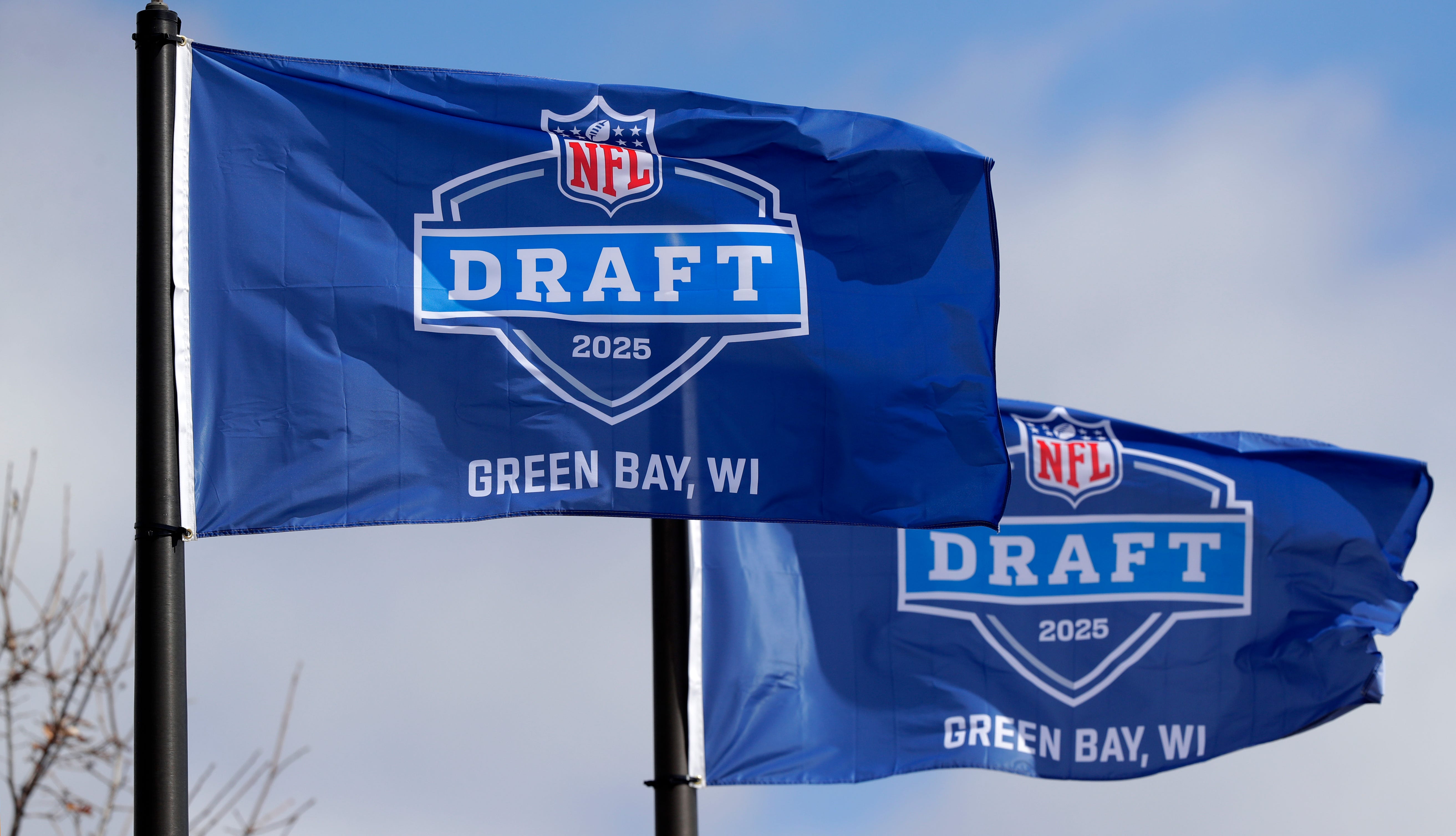 Flags promoting the 2025 NFL Draft pictured on April 19, 2025, at Leicht Memorial Park in Green Bay, Wis.