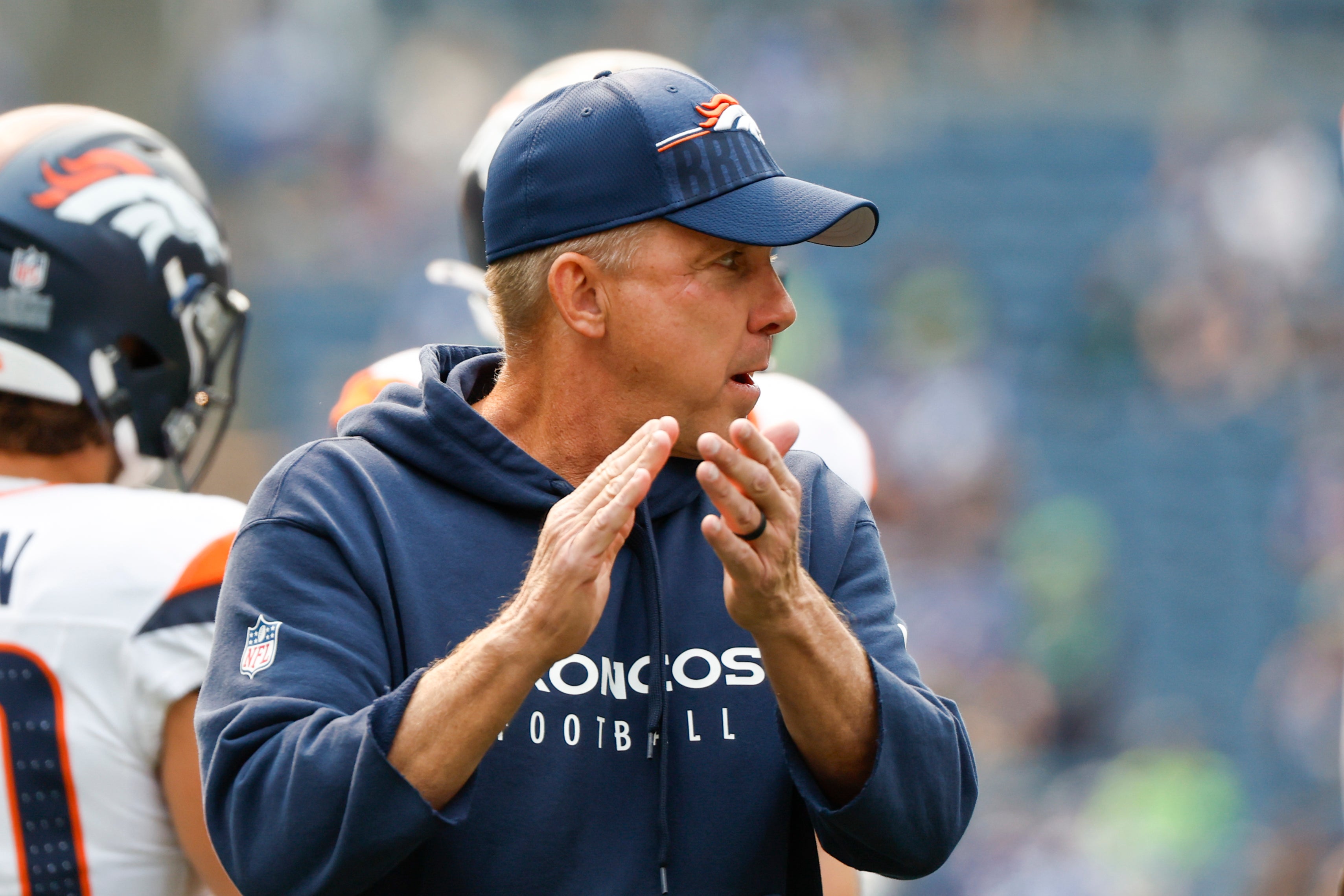 Denver Broncos head coach Sean Payton watches pregame warmups