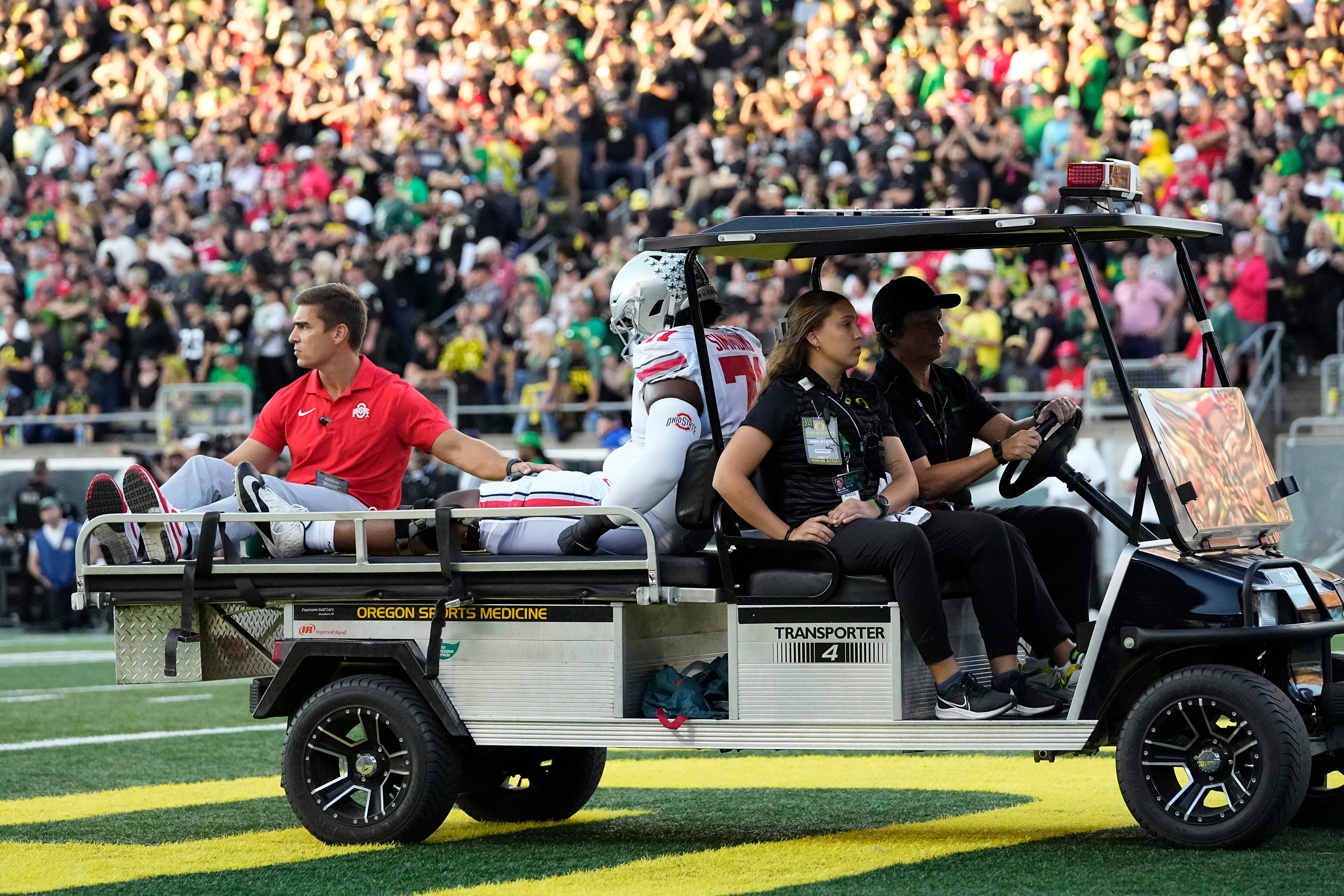 Oct 12, 2024; Eugene, Oregon, USA; Ohio State Buckeyes left tackle Josh Simmons is carted off the field during the first half of the NCAA football game against the Oregon Ducks at Autzen Stadium