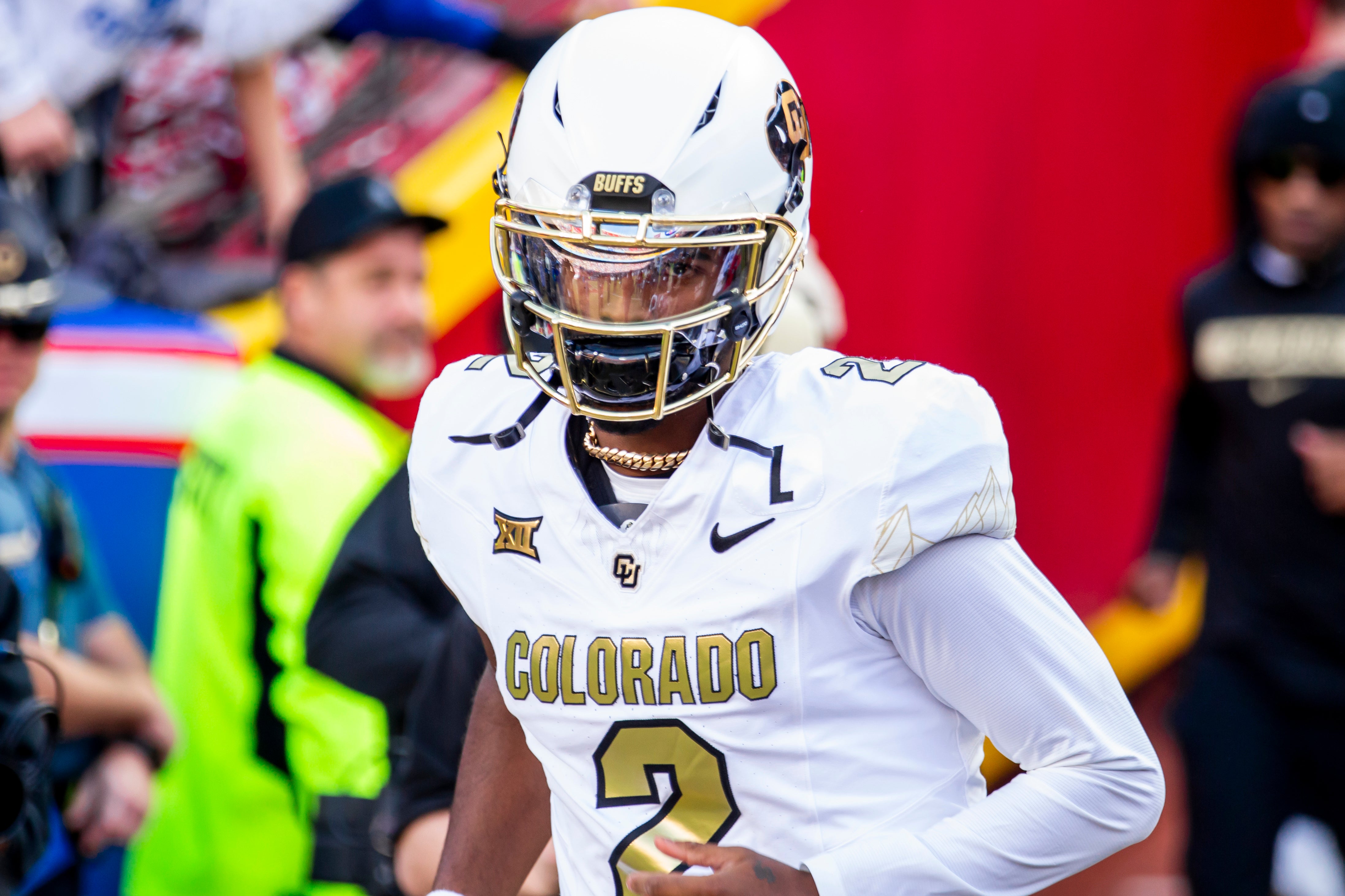 Nov 23, 2024; Kansas City, Missouri, USA; Colorado quarterback Shedeur Sanders (2) jogs onto the field during the game against the Kansas Jayhawks at GEHA Field at Arrowhead Stadium.