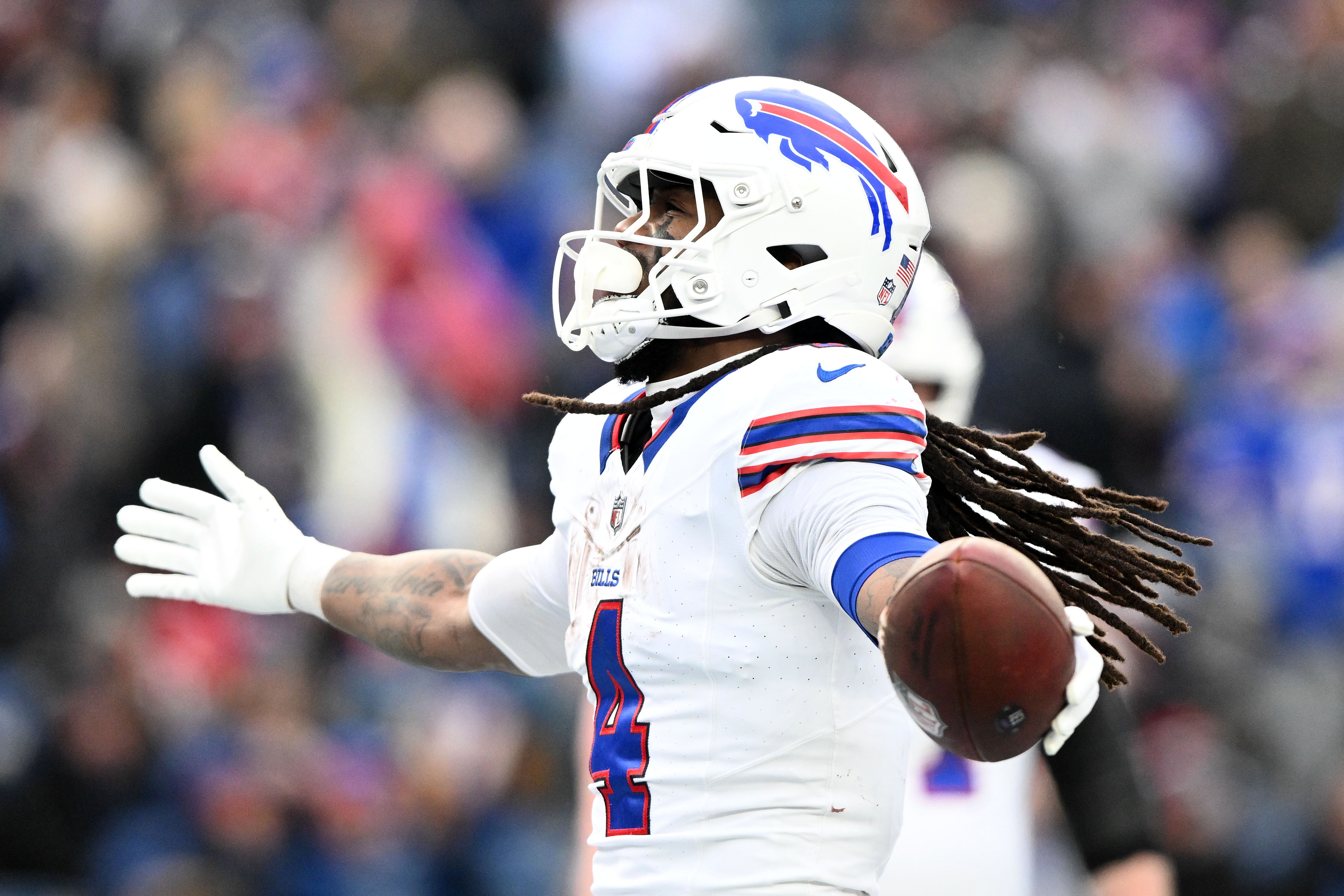 Jan 5, 2025; Foxborough, Massachusetts, USA; Buffalo Bills running back James Cook (4) reacts after scoring a touchdown against the New England Patriots during the second half at Gillette Stadium.