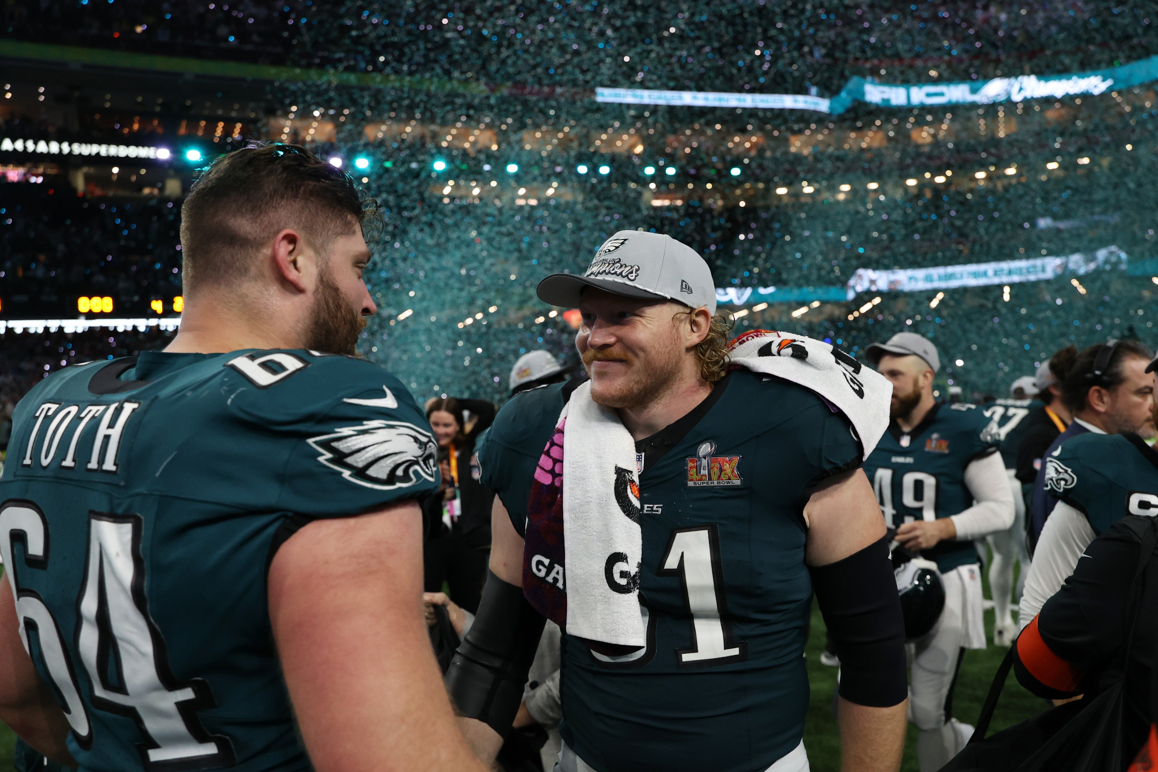 Philadelphia Eagles linebacker Jeremiah Trotter Jr. (54) celebrates with Eagles center Cam Jurgens (51) after Super Bowl LIX against the Kansas City Chiefs at Caesars Superdome.