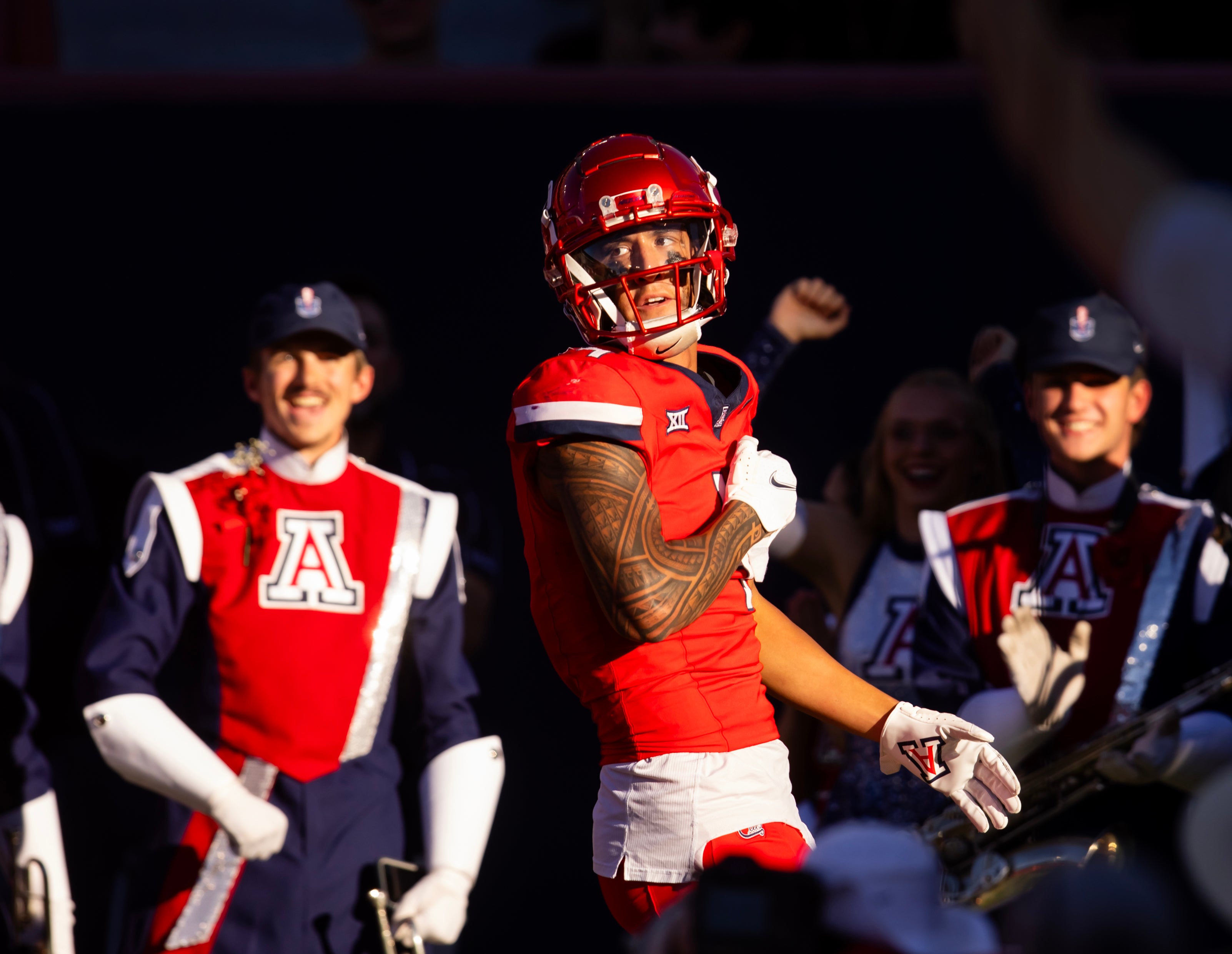 Arizona Wildcats wide receiver Tetairoa McMillan (4) celebrates a touchdown against the Arizona State Sun Devils in the second half during the Territorial Cup at Arizona Stadium.