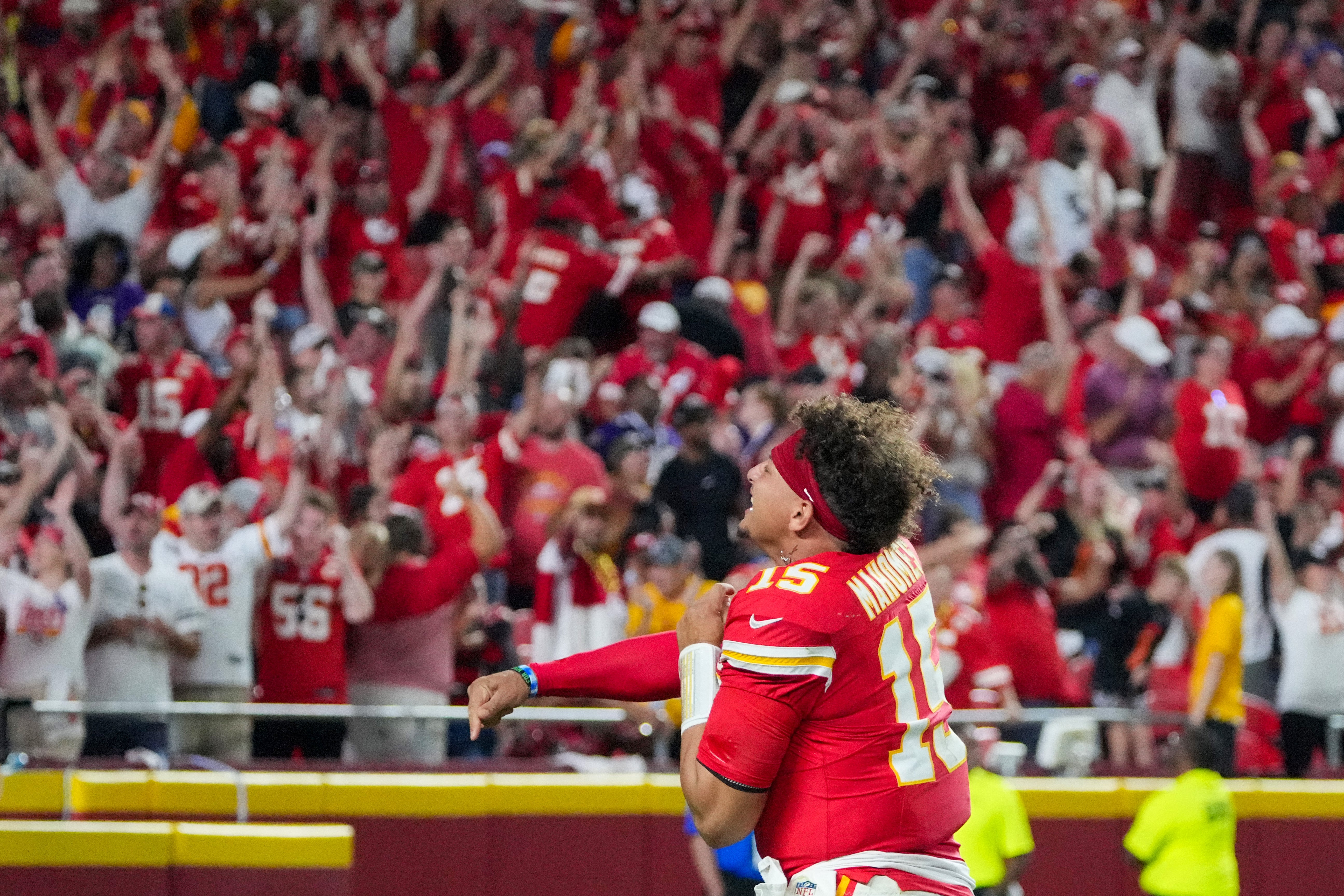 Kansas City Chiefs quarterback Patrick Mahomes (15) celebrates toward fans after the win over the Ravens