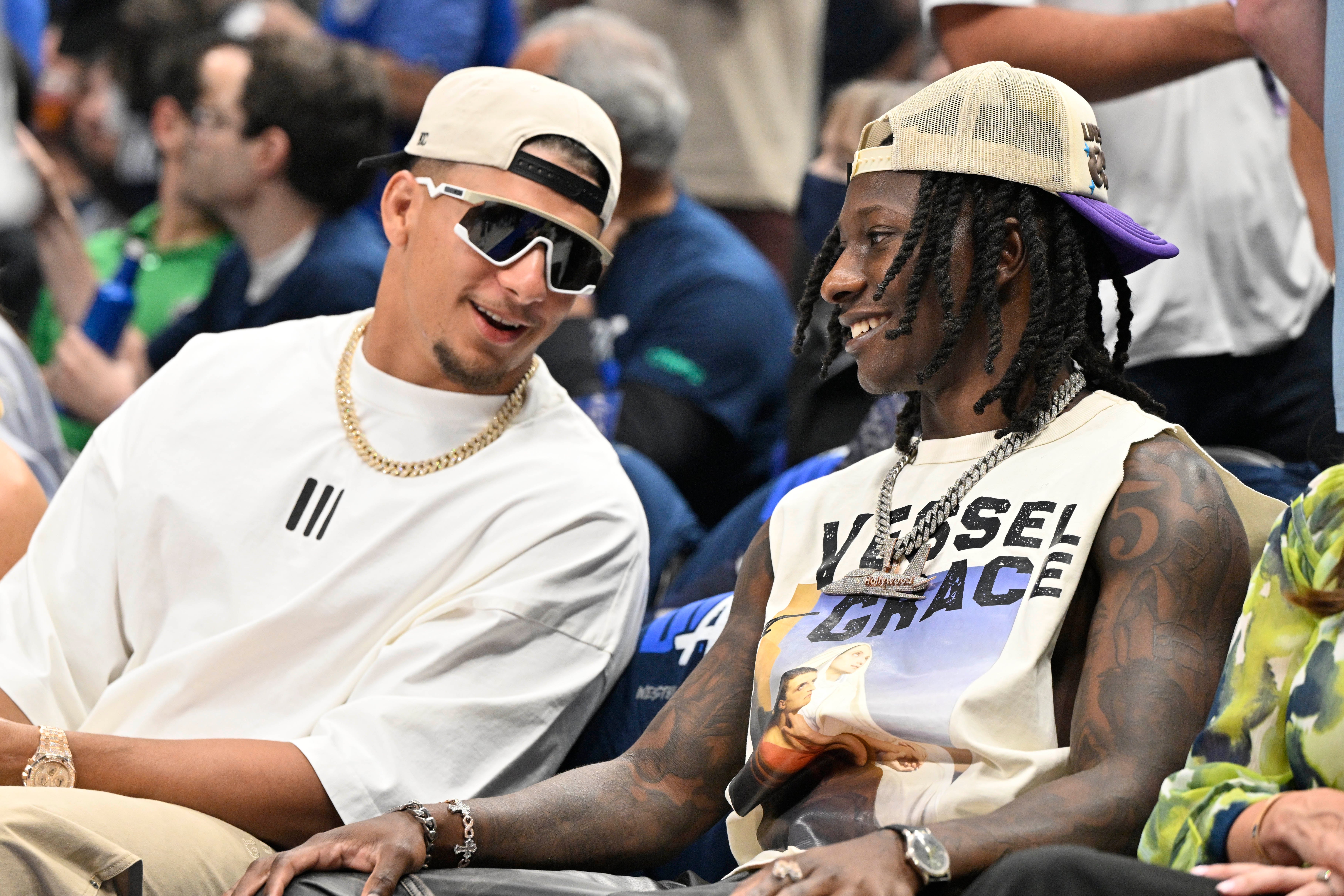 May 26, 2024; Dallas, Texas, USA; Kansas City Chiefs players Patrick Mahomes (left) and Hollywood Brown (right) look on in the first half between the Dallas Mavericks and the Minnesota Timberwolves during game three of the western conference finals for the 2024 NBA playoffs at American Airlines Center.