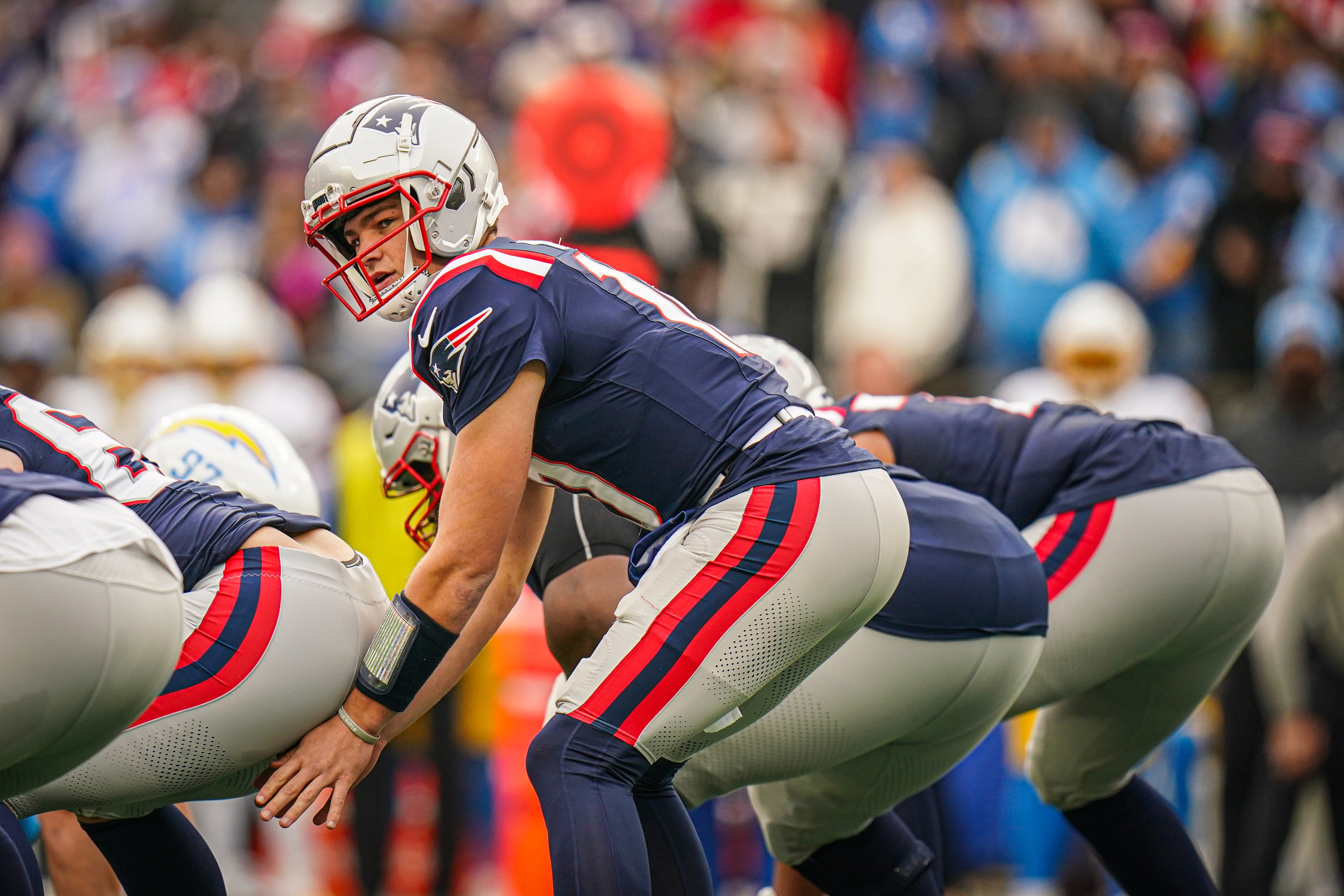 Dec 28, 2024; Foxborough, Massachusetts, USA; New England Patriots quarterback Drake Maye (10) on the field against the Los Angeles Chargers in the first quarter at Gillette Stadium.
