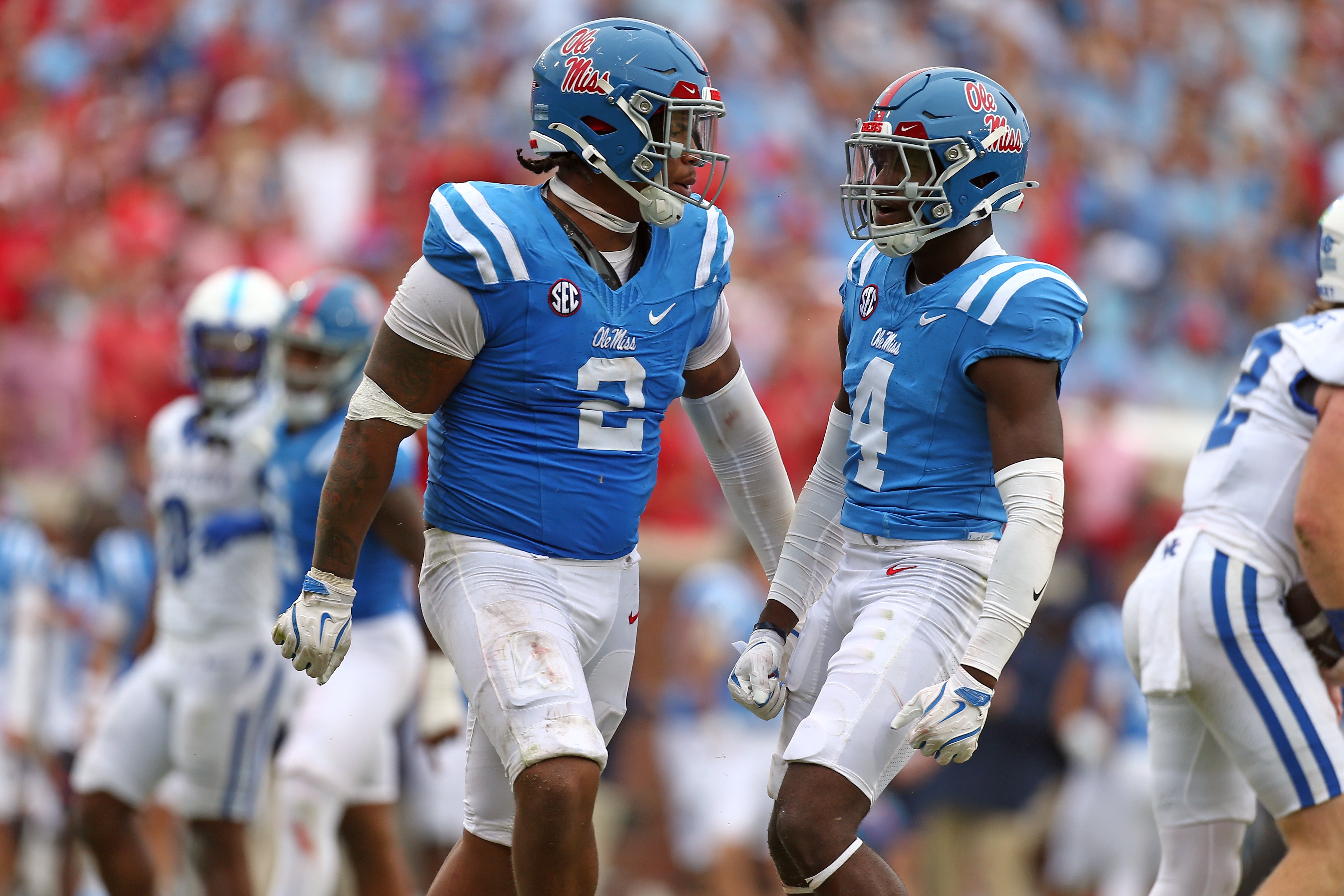 Sep 28, 2024; Oxford, Mississippi, USA; Mississippi Rebels defensive linemen Walter Nolen (2) and linebacker Suntarine Perkins (4) reacts after a tackle during the second half against the Kentucky Wildcats at Vaught-Hemingway Stadium.
