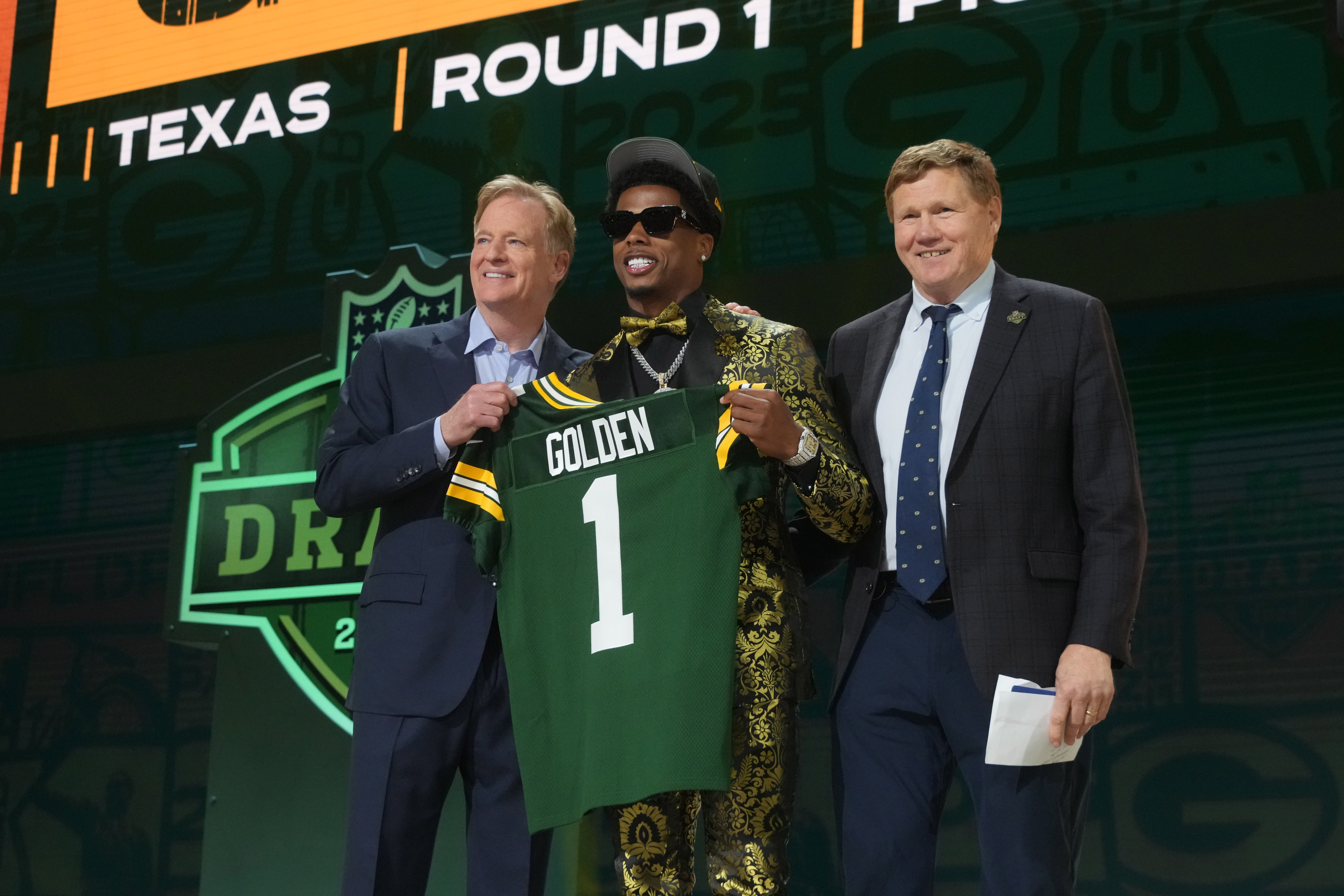 NFL commissioner Roger Goodell and Green Bay Packers president Mark Murphy with Texas Longhorns wide receiver Matthew Golden after he is selected by the Green Bay Packers as the number 23 pick in the first round of the 2025 NFL Draft at Lambeau Field.