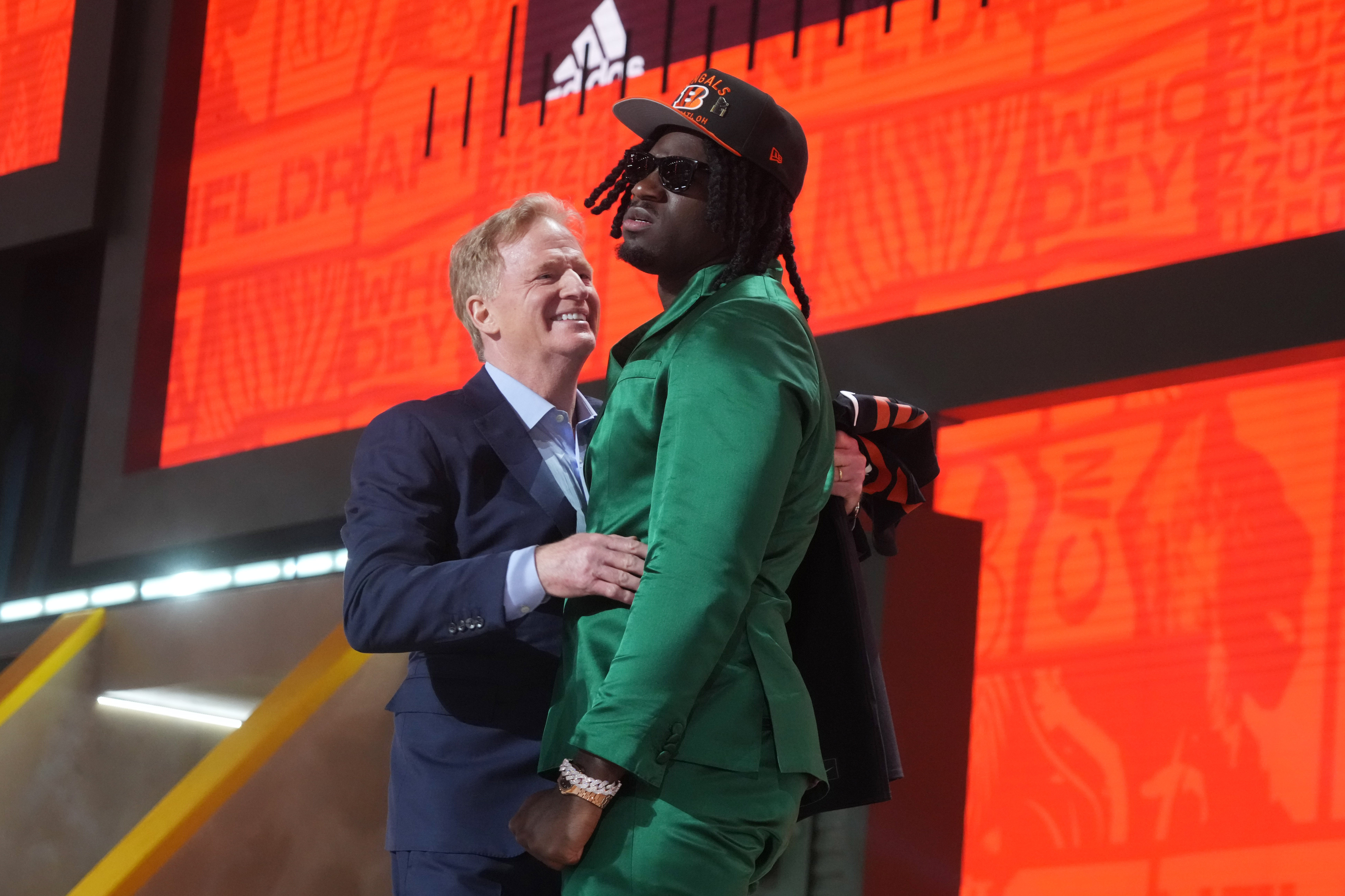 Apr 24, 2025; Green Bay, WI, USA; NFL commissioner Roger Goodell with Texas A&M Aggies defensive end Shemar Stewart after her is selected by the Cincinnati Bengals as the number seventeen pick in the first round of the 2025 NFL Draft at Lambeau Field.
