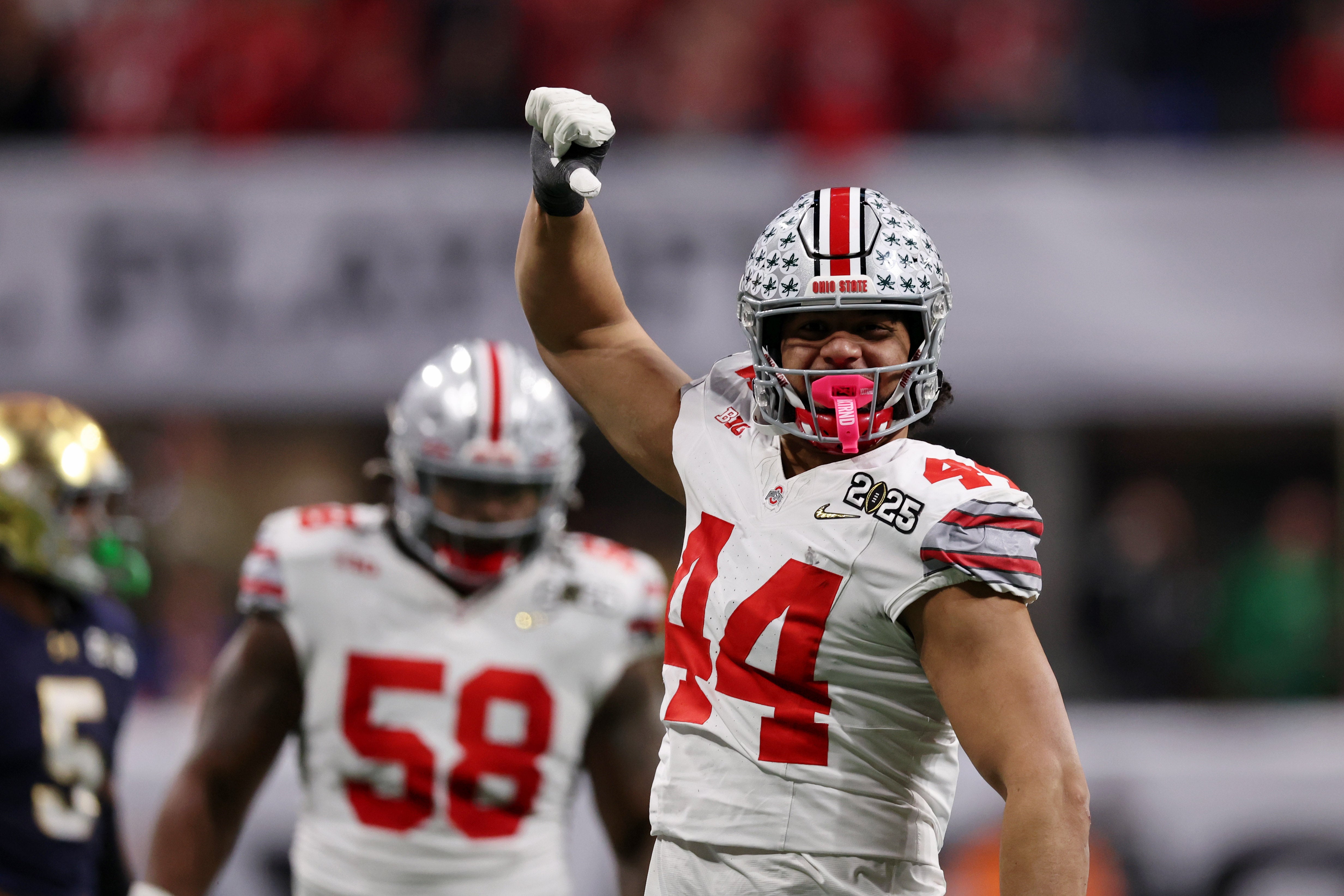 Jan 20, 2025; Atlanta, GA, USA; Ohio State Buckeyes defensive end JT Tuimoloau (44) reacts after a play against the Notre Dame Fighting Irish during the first half the CFP National Championship college football game at Mercedes-Benz Stadium.