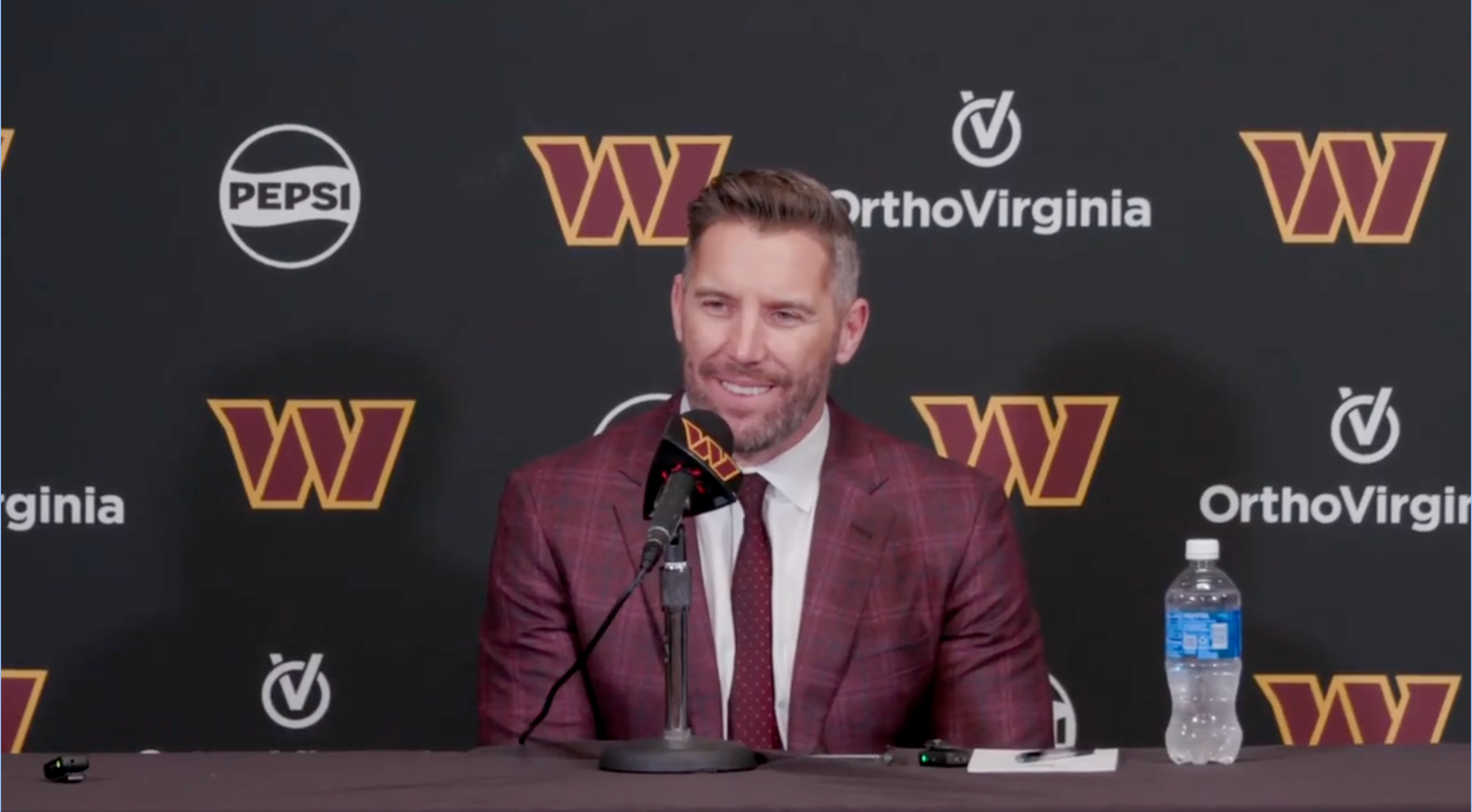 Adam Peters speaks with reporters after picking Josh Conerly Jr. in the first round of the NFL Draft.