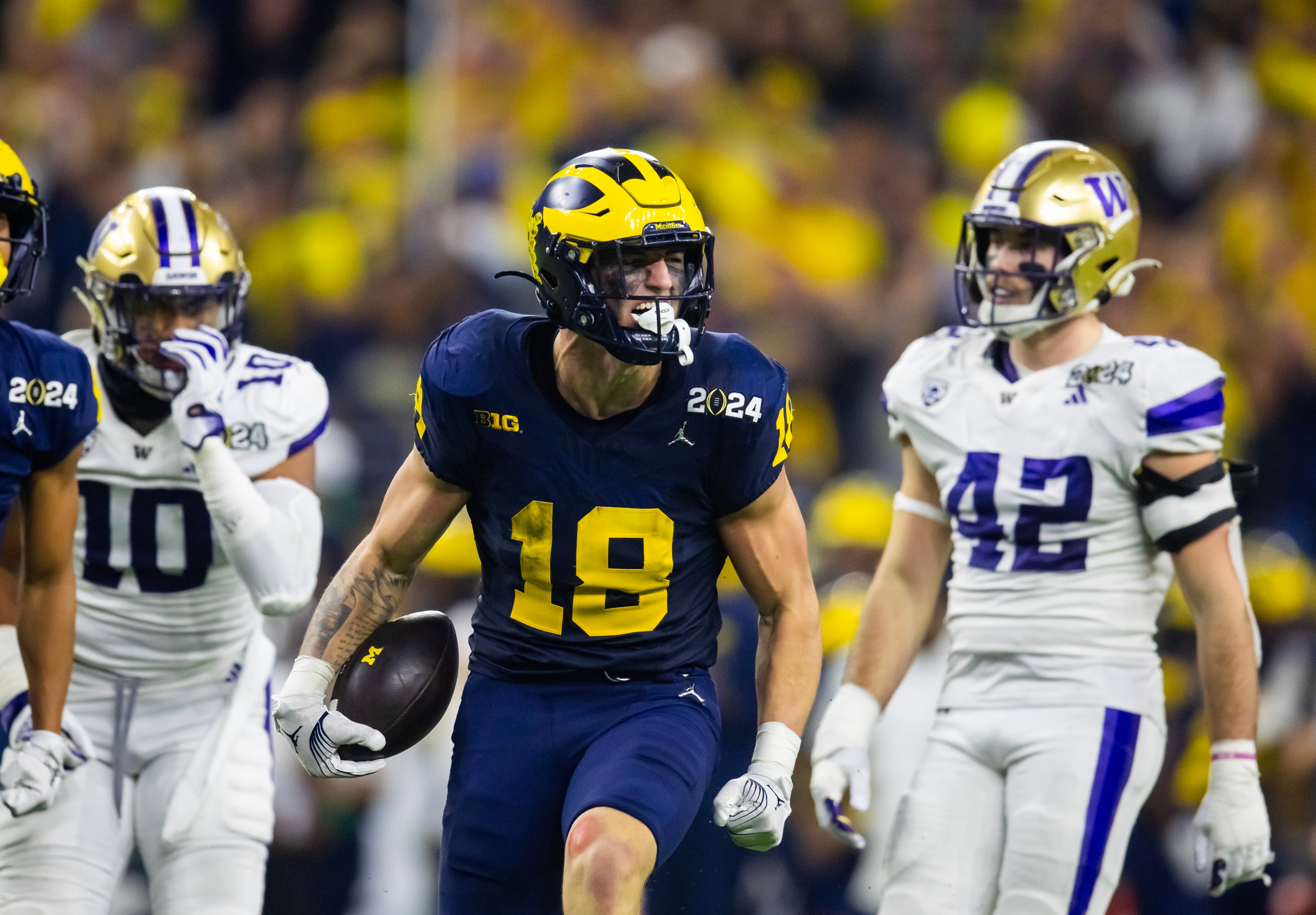Jan 8, 2024; Houston, TX, USA; Michigan Wolverines tight end Colston Loveland (18) against the Washington Huskies during the 2024 College Football Playoff national championship game at NRG Stadium.
