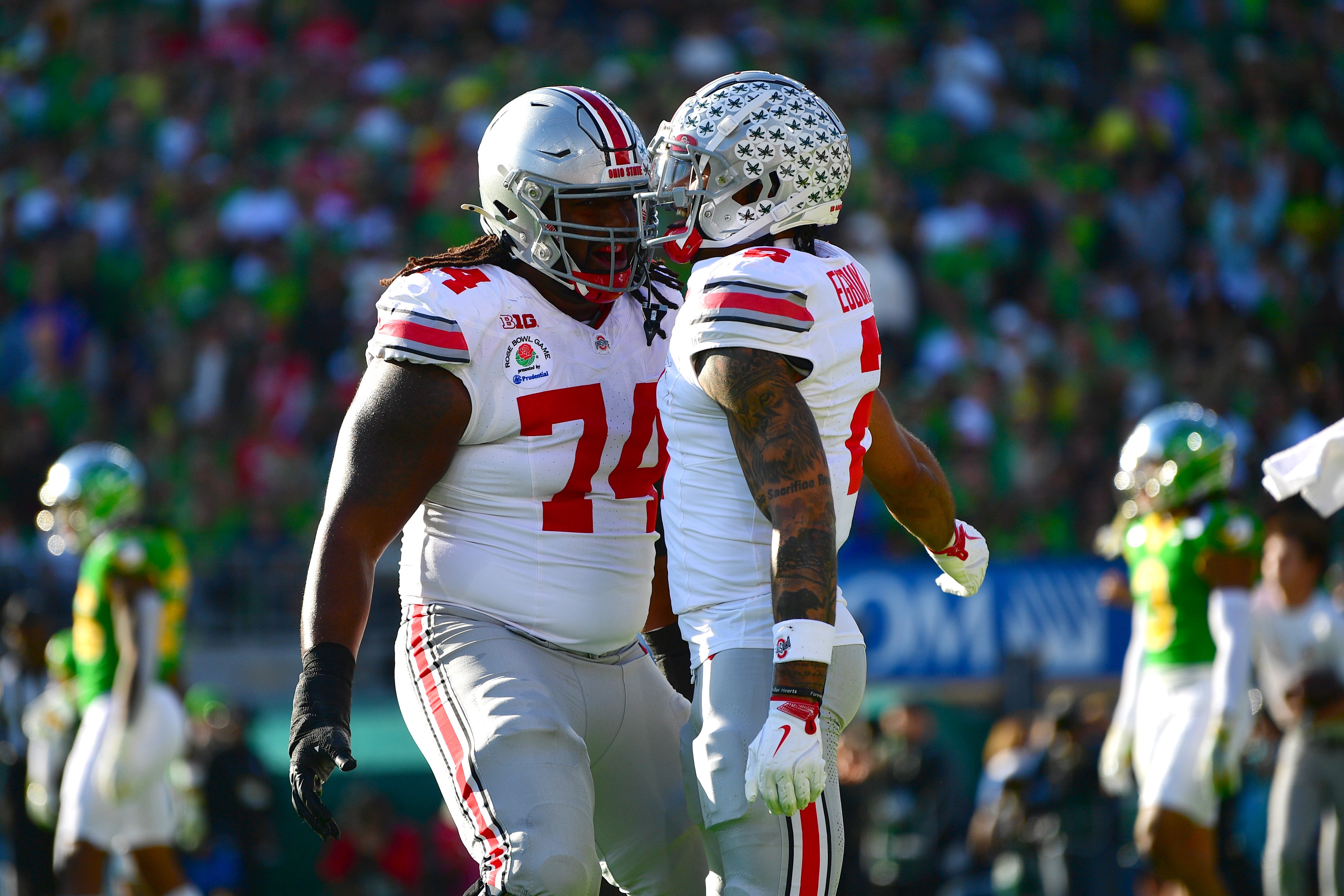 Jan 1, 2025; Pasadena, CA, USA; Ohio State Buckeyes wide receiver Emeka Egbuka (2) celebrates with offensive lineman Donovan Jackson (74) after a touchdown in the first quarter against the Oregon Ducks in the 2025 Rose Bowl college football quarterfinal game at Rose Bowl Stadium.
